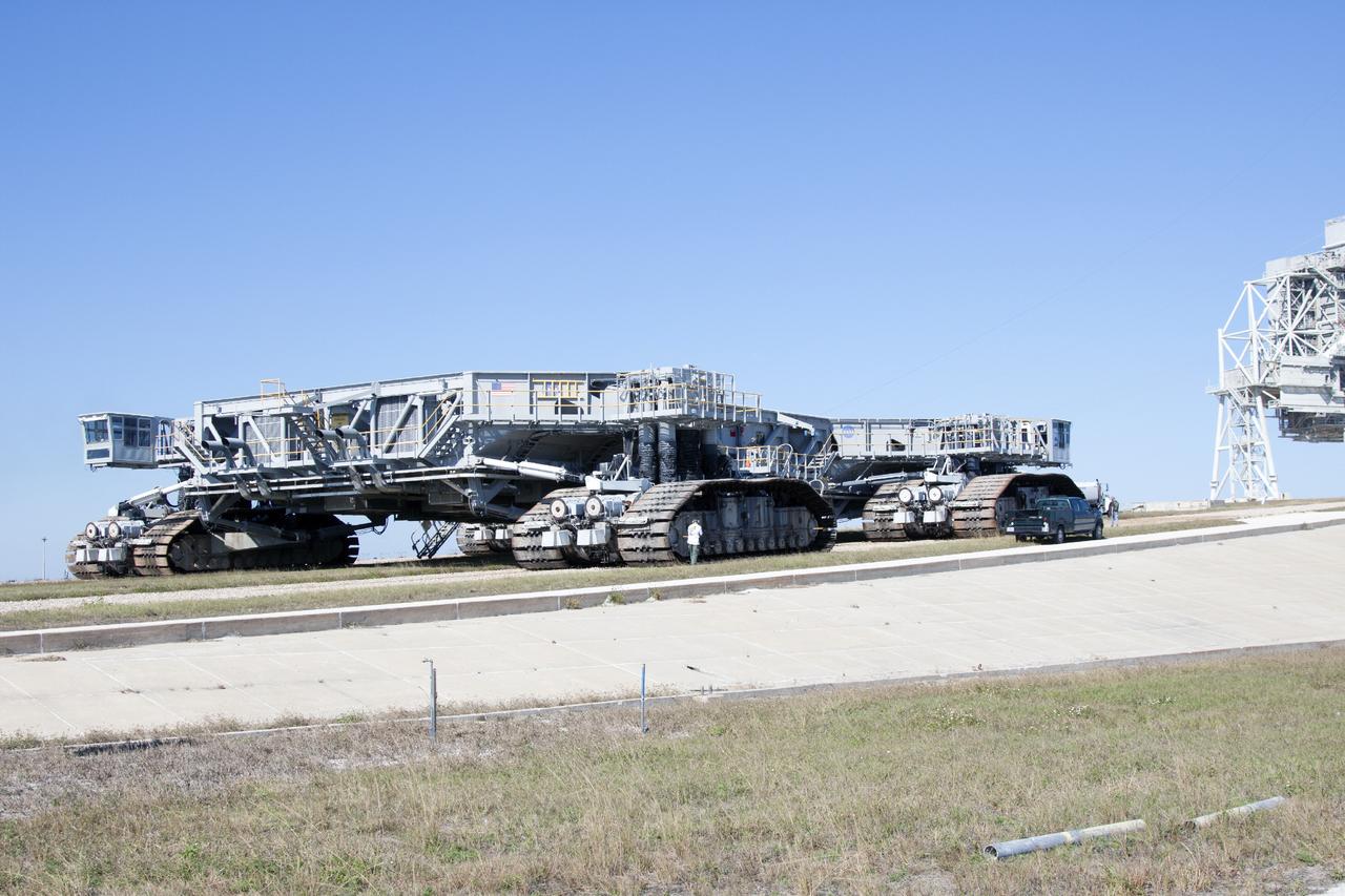 CAPE CANAVERAL, Fla. -- Crawler-transporter 1 approaches the slope on the crawlerway leading up to Launch Pad 39A at NASA’s Kennedy Space Center in Florida. New jacking, equalizing and leveling, or JEL, hydraulic cylinders were installed on CT-1 and will undergo a leveling and turning test as the crawler travels along the slope to the top of the pad. The Ground Systems Development and Operations Program at Kennedy continues to upgrade the crawler-transporter as part of its general maintenance. CT-1 could be available to carry a variety of launch vehicles to the launch pad. Two crawler-transporters were used to carry the mobile launcher platform and space shuttle to Launch Complex 39 for space shuttle launches for 30 years. Photo credit: NASA/Jim Grossmann
