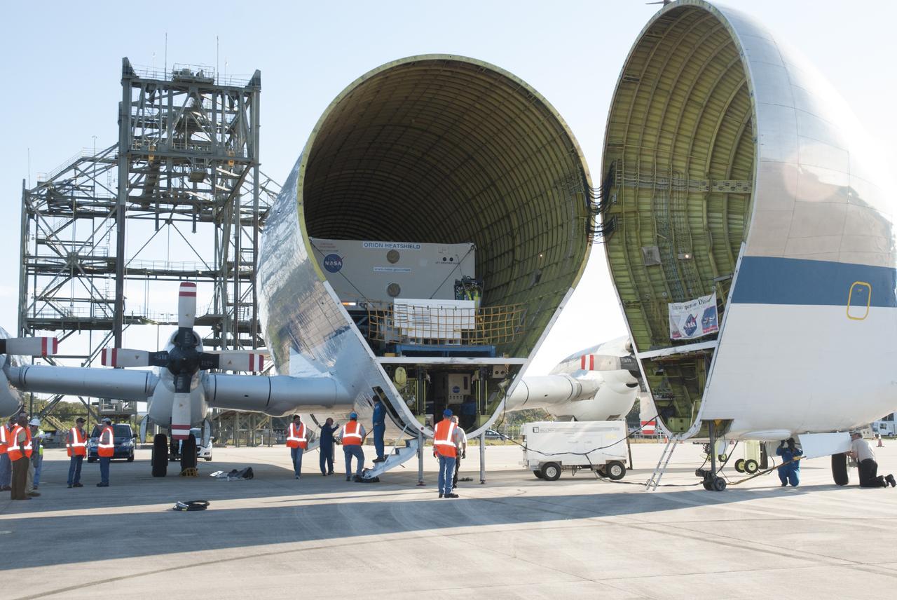 CAPE CANAVERAL, Fla. – At the Shuttle Landing Facility at NASA's Kennedy Space Center in Florida, the heat shield for the agency's Orion spacecraft is about to be offloaded from the Super Guppy aircraft. The largest of its kind ever built, the heat shield is planned for installation on the Orion crew module in March of next year. The Orion spacecraft is scheduled to make its first unpiloted flight test, Exploration Flight Test-1 EFT-1, in September 2014.      The Orion spacecraft is designed to meet requirements for traveling beyond low-Earth orbit. The spacecraft will serve as the exploration vehicle that will carry crews to space, sustain the astronauts during the space travel and provide safe re-entry from deep space. For more information, visit: http://www.nasa.gov/orion Photo credit: NASA/Charisse Nasher