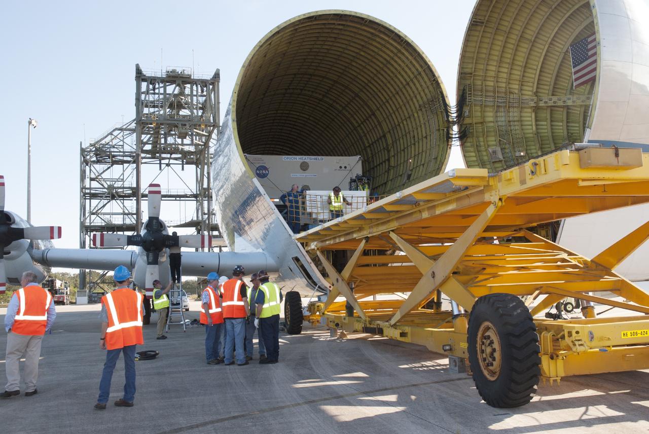 CAPE CANAVERAL, Fla. – At the Shuttle Landing Facility at NASA's Kennedy Space Center in Florida, the heat shield for the agency's Orion spacecraft is being offloaded from the Super Guppy aircraft. The largest of its kind ever built, the heat shield is planned for installation on the Orion crew module in March of next year. The Orion spacecraft is scheduled to make its first unpiloted flight test, Exploration Flight Test-1 EFT-1, in September 2014.      The Orion spacecraft is designed to meet requirements for traveling beyond low-Earth orbit. The spacecraft will serve as the exploration vehicle that will carry crews to space, sustain the astronauts during the space travel and provide safe re-entry from deep space. For more information, visit: http://www.nasa.gov/orion Photo credit: NASA/Charisse Nasher
