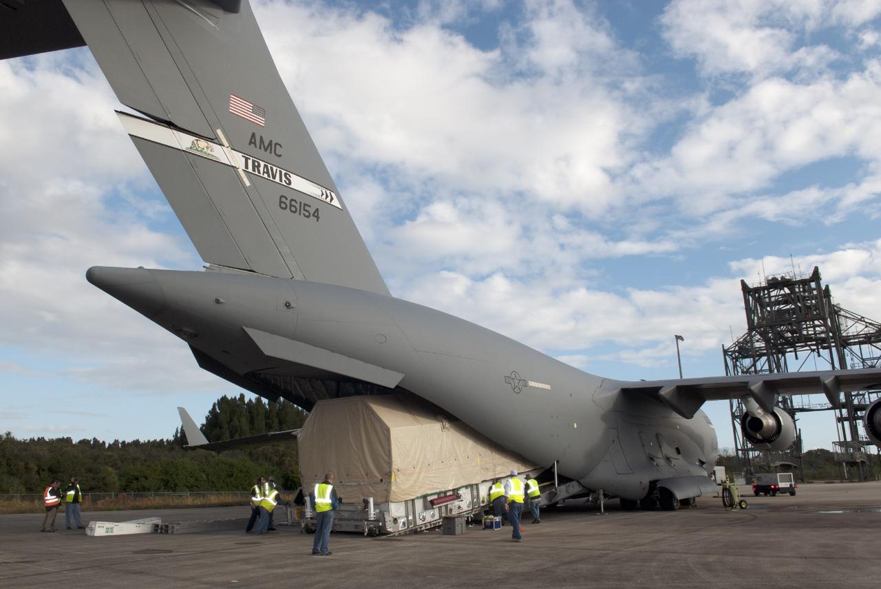 CAPE CANAVERAL, Fla. – Workers unload NASA's TDRS-L satellite from the hold of a C-17 transport aircraft at the Shuttle Landing Facility at NASA's Kennedy Space Center in Florida. The TDRS is the latest spacecraft destined for the agency's constellation of communications satellites that allows nearly continuous contact with orbiting spacecraft ranging from the International Space Station and Hubble Space Telescope to the array of scientific observatories. Photo credit: NASA/Charisse Nahser