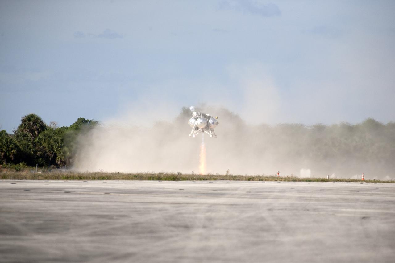 CAPE CANAVERAL, Fla. – The first free flight of the Project Morpheus prototype lander was conducted at the Shuttle Landing Facility at NASA’s Kennedy Space Center in Florida. Smoke filled the air as the engine fired and the Morpheus lander launched from the ground over a flame trench. During the 54-second test, it ascended approximately 50 feet, and hovered for about 15 seconds. The lander then flew forward and landed on its pad about 23 feet from the launch point. Testing of the prototype lander was performed at NASA’s Johnson Space Center in Houston in preparation for tethered and free flight testing at Kennedy. Project Morpheus integrates NASA’s automated landing and hazard avoidance technology, or ALHAT, with an engine that runs on liquid oxygen and methane, or green propellants, into a fully-operational lander that could deliver cargo to asteroids and other planetary surfaces.    The landing facility will provide the lander with the kind of field necessary for realistic testing, complete with rocks, craters and hazards to avoid. Morpheus’ ALHAT payload allows it to navigate to clear landing sites amidst rocks, craters and other hazards during its descent. Project Morpheus is being managed under the Advanced Exploration Systems, or AES, Division in NASA’s Human Exploration and Operations Mission Directorate. The efforts in AES pioneer new approaches for rapidly developing prototype systems, demonstrating key capabilities and validating operational concepts for future human missions beyond Earth orbit. For more information on Project Morpheus, visit http://morpheuslander.jsc.nasa.gov.  Photo credit: NASA/Kim Shiflett