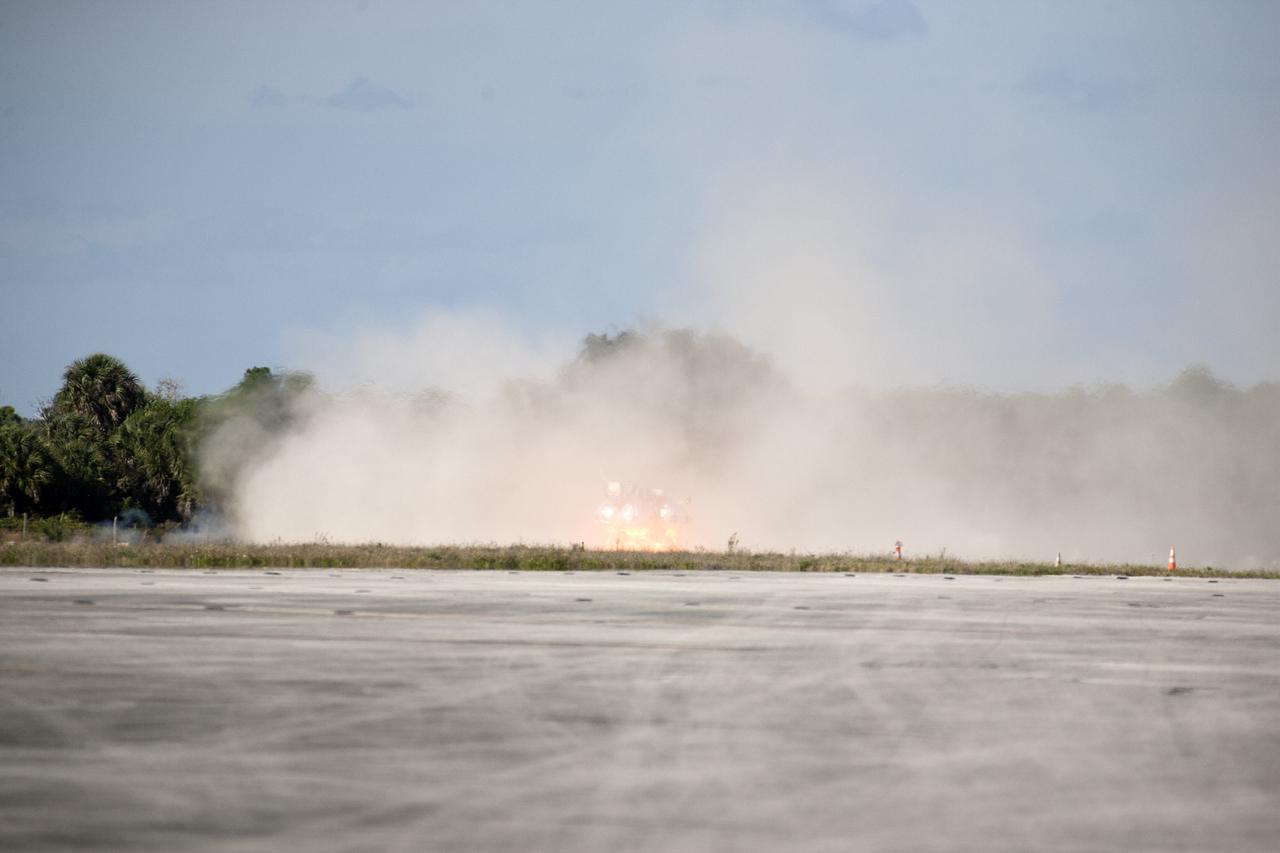 CAPE CANAVERAL, Fla. – The first free flight of the Project Morpheus prototype lander was conducted at the Shuttle Landing Facility at NASA’s Kennedy Space Center in Florida. Smoke filled the air as the engine fired and the Morpheus lander launched from the ground over a flame trench. During the 54-second test, it ascended approximately 50 feet, and hovered for about 15 seconds. The lander then flew forward and landed on its pad about 23 feet from the launch point. Testing of the prototype lander was performed at NASA’s Johnson Space Center in Houston in preparation for tethered and free flight testing at Kennedy. Project Morpheus integrates NASA’s automated landing and hazard avoidance technology, or ALHAT, with an engine that runs on liquid oxygen and methane, or green propellants, into a fully-operational lander that could deliver cargo to asteroids and other planetary surfaces.      The landing facility will provide the lander with the kind of field necessary for realistic testing, complete with rocks, craters and hazards to avoid. Morpheus’ ALHAT payload allows it to navigate to clear landing sites amidst rocks, craters and other hazards during its descent. Project Morpheus is being managed under the Advanced Exploration Systems, or AES, Division in NASA’s Human Exploration and Operations Mission Directorate. The efforts in AES pioneer new approaches for rapidly developing prototype systems, demonstrating key capabilities and validating operational concepts for future human missions beyond Earth orbit. For more information on Project Morpheus, visit http://morpheuslander.jsc.nasa.gov.  Photo credit: NASA/Kim Shiflett