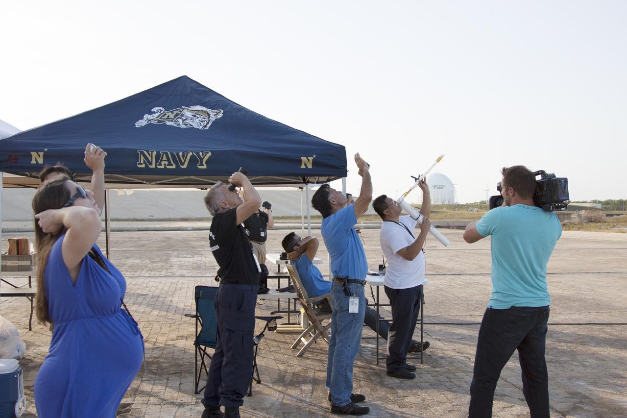 CAPE CANAVERAL, Fla. -- At NASA's Kennedy Space Center in Florida, student engineers track a small rocket after liftoff as part of the agency's Rocket University program.    As part of Rocket University, the engineers are given an opportunity to work a fast-track project to develop skills in developing spacecraft systems of the future. As NASA plans for future spaceflight programs to low-Earth orbit and beyond, teams of engineers at Kennedy are gaining experience in designing and flying launch vehicle systems on a small scale. Four teams of five to eight members from Kennedy are designing rockets complete with avionics and recovery systems. Launch operations require coordination with federal agencies, just as they would with rockets launched in support of a NASA mission. Photo credit: NASA/Jim Grossmann