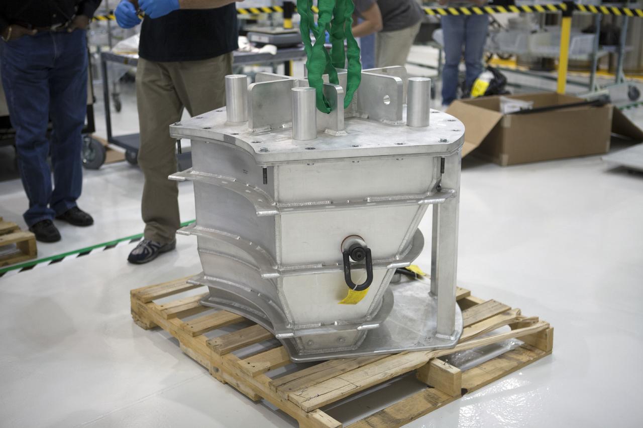 CAPE CANAVERAL, Fla. -- One of the three main parachutes for the Orion spacecraft is enclosed in its shipping container on a pallet inside the Operations and Checkout Building high bay at NASA’s Kennedy Space Center in Florida. Technicians will prepare the parachute for installation on Orion.    The Orion spacecraft is being prepared for its first unpiloted flight test, Exploration Flight Test-1, or EFT-1, scheduled for launch atop a Delta IV rocket in September 2014. The Orion spacecraft is designed to carry astronauts to destinations not yet explored by humans. It will have emergency abort capability, sustain the crew during space travel and provide safe re-entry from deep space return velocities. Orion is scheduled to launch atop NASA’s Space Launch System rocket in 2017. For more information, visit http://www.nasa.gov/orion. Photo credit: NASA/Kim Shiflett