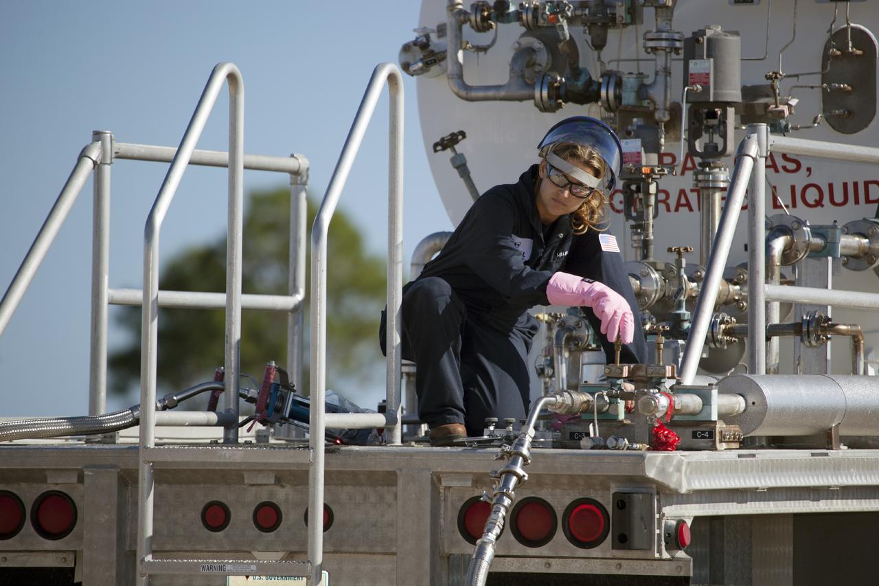 CAPE CANAVERAL, Fla. -- A technician prepares the Project Morpheus prototype lander for a second free flight test at the north end of the Shuttle Landing Facility at NASA’s Kennedy Space Center in Florida. Testing of the prototype lander was performed at NASA’s Johnson Space Center in Houston in preparation for tethered and free flight testing at Kennedy. Project Morpheus integrates NASA’s automated landing and hazard avoidance technology, or ALHAT, with an engine that runs on liquid oxygen and methane, or green propellants, into a fully-operational lander that could deliver cargo to other planetary surfaces.    The landing facility will provide the lander with the kind of field necessary for realistic testing, complete with rocks, craters and hazards to avoid. Morpheus’ ALHAT payload allows it to navigate to clear landing sites amidst rocks, craters and other hazards during its descent. Project Morpheus is being managed under the Advanced Exploration Systems, or AES, Division in NASA’s Human Exploration and Operations Mission Directorate. The efforts in AES pioneer new approaches for rapidly developing prototype systems, demonstrating key capabilities and validating operational concepts for future human missions beyond Earth orbit. For more information on Project Morpheus, visit http://morpheuslander.jsc.nasa.gov.  Photo credit: NASA/Dimitri Gerondidakis