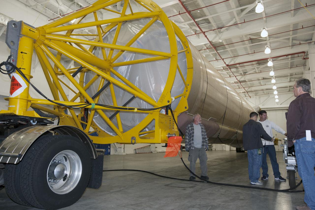CAPE CANAVERAL, Fla. – The United Launch Alliance Atlas V first stage booster that will boost the Tracking and Data Relay Satellite, or TDRS-L, spacecraft into orbit is being prepared for transport from the hangar at the Atlas Spaceflight Operations Center on Cape Canaveral Air Force Station to Launch Complex 41. TDRS-L is the second of three next-generation satellites designed to ensure vital operational continuity for the NASA Space Network. It is scheduled to launch from Cape Canaveral's Space Launch Complex 41 atop an Atlas V rocket in January 2014. The current Tracking and Data Relay Satellite system consists of eight in-orbit satellites distributed to provide near continuous information relay service to missions such as the Hubble Space Telescope and International Space Station. For more information, visit: http://www.nasa.gov/content/tracking-and-data-relay-satellite-tdrs/ Photo credit: NASA/Kim Shiflett