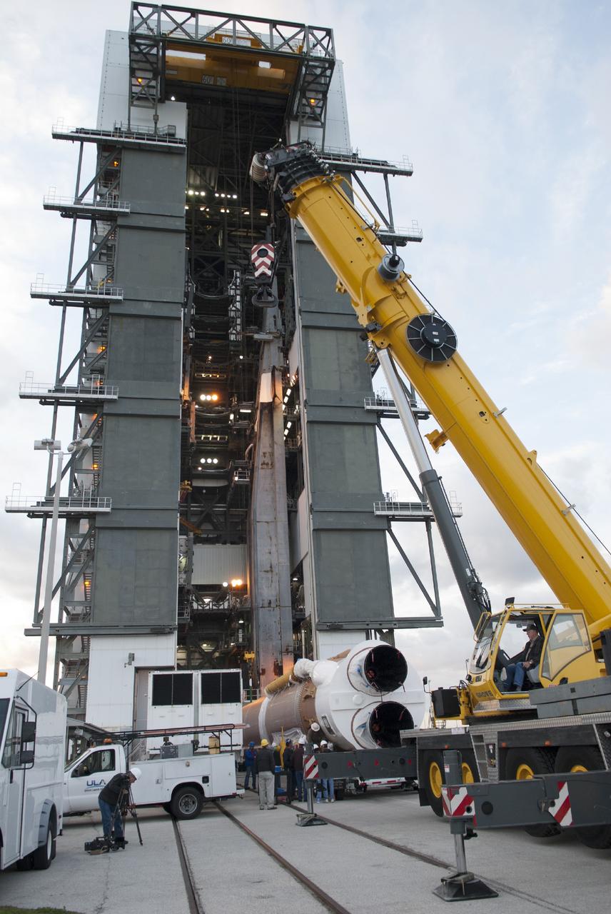 CAPE CANAVERAL, Fla. – At Cape Canaveral Air Force Station's Vertical Integration Facility at Launch Complex 41, a crane is positioned to support stacking of the United Launch Alliance Atlas V rocket that will boost the Tracking and Data Relay Satellite, or TDRS-L, spacecraft into orbit. TDRS-L is the second of three next-generation satellites designed to ensure vital operational continuity for the NASA Space Network. It is scheduled to launch from Cape Canaveral's Space Launch Complex 41 atop an Atlas V rocket in January 2014. The current Tracking and Data Relay Satellite system consists of eight in-orbit satellites distributed to provide near continuous information relay service to missions such as the Hubble Space Telescope and International Space Station. For more information, visit: http://www.nasa.gov/content/tracking-and-data-relay-satellite-tdrs/ Photo credit: NASA/Charisse Nahser