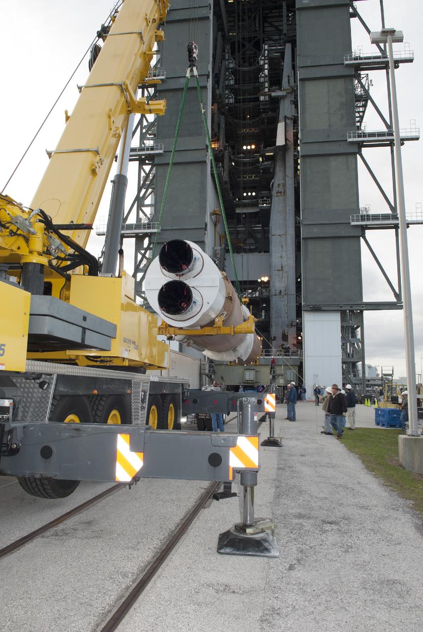 CAPE CANAVERAL, Fla. – At Cape Canaveral Air Force Station, the first stage of the United Launch Alliance Atlas V rocket is lifted for stacking in the Vertical Integration Facility at Launch Complex 41. The vehicle will be used to boost the Tracking and Data Relay Satellite, or TDRS-L, spacecraft to orbit. TDRS-L is the second of three next-generation satellites designed to ensure vital operational continuity for the NASA Space Network. It is scheduled to launch from Cape Canaveral's Space Launch Complex 41 atop an Atlas V rocket in January 2014. The current Tracking and Data Relay Satellite system consists of eight in-orbit satellites distributed to provide near continuous information relay service to missions such as the Hubble Space Telescope and International Space Station. For more information, visit: http://www.nasa.gov/content/tracking-and-data-relay-satellite-tdrs/ Photo credit: NASA/Charisse Nahser