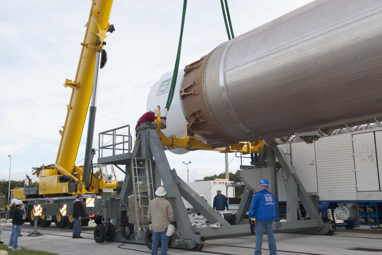 CAPE CANAVERAL, Fla. – At Cape Canaveral Air Force Station, engineers and technicians support lifting the first stage of the United Launch Alliance Atlas V rocket during stacking operations in the Vertical Integration Facility at Launch Complex 41. The vehicle will be used to boost the Tracking and Data Relay Satellite, or TDRS-L, spacecraft to orbit. TDRS-L is the second of three next-generation satellites designed to ensure vital operational continuity for the NASA Space Network. It is scheduled to launch from Cape Canaveral's Space Launch Complex 41 atop an Atlas V rocket in January 2014. The current Tracking and Data Relay Satellite system consists of eight in-orbit satellites distributed to provide near continuous information relay service to missions such as the Hubble Space Telescope and International Space Station. For more information, visit: http://www.nasa.gov/content/tracking-and-data-relay-satellite-tdrs/ Photo credit: NASA/Charisse Nahser
