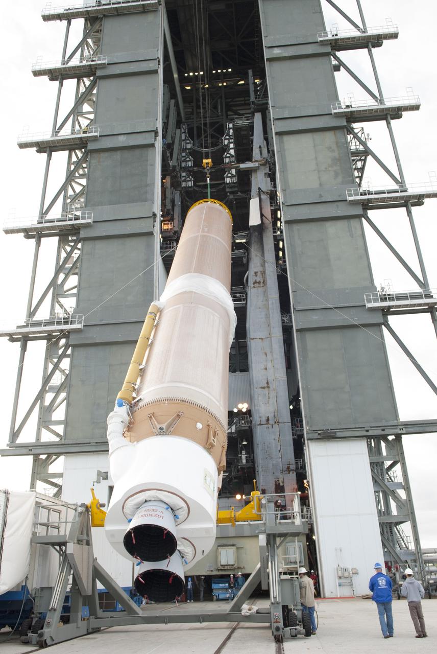 CAPE CANAVERAL, Fla. – At Cape Canaveral Air Force Station, the first stage of the United Launch Alliance Atlas V rocket is lifted for stacking in the Vertical Integration Facility at Launch Complex 41. The vehicle will be used to boost the Tracking and Data Relay Satellite, or TDRS-L, spacecraft to orbit. TDRS-L is the second of three next-generation satellites designed to ensure vital operational continuity for the NASA Space Network. It is scheduled to launch from Cape Canaveral's Space Launch Complex 41 atop an Atlas V rocket in January 2014. The current Tracking and Data Relay Satellite system consists of eight in-orbit satellites distributed to provide near continuous information relay service to missions such as the Hubble Space Telescope and International Space Station. For more information, visit: http://www.nasa.gov/content/tracking-and-data-relay-satellite-tdrs/ Photo credit: NASA/Charisse Nahser