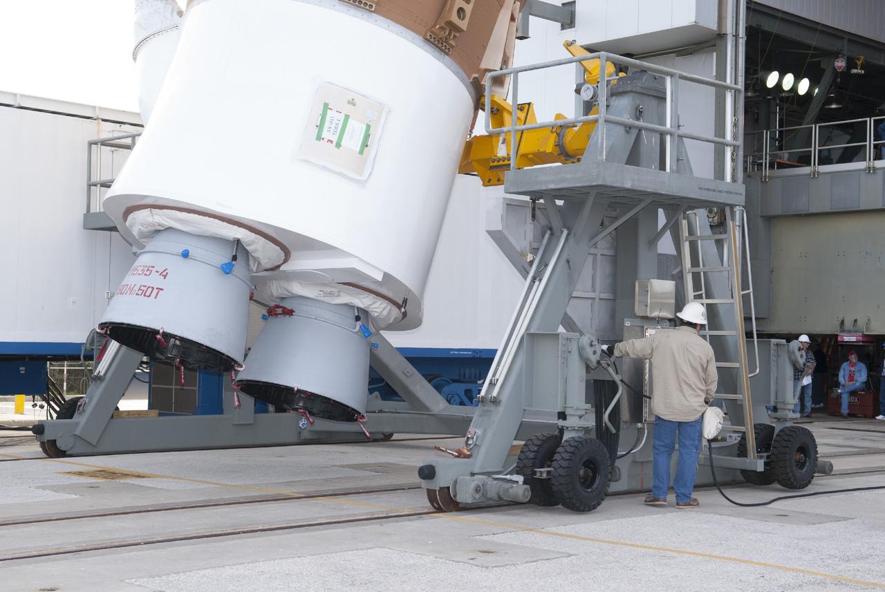CAPE CANAVERAL, Fla. – At Cape Canaveral Air Force Station, a technician supports lifting of a United Launch Alliance Atlas V rocket in the Vertical Integration Facility at Launch Complex 41. The vehicle will be used to boost the Tracking and Data Relay Satellite, or TDRS-L, spacecraft to orbit. TDRS-L is the second of three next-generation satellites designed to ensure vital operational continuity for the NASA Space Network. It is scheduled to launch from Cape Canaveral's Space Launch Complex 41 atop an Atlas V rocket in January 2014. The current Tracking and Data Relay Satellite system consists of eight in-orbit satellites distributed to provide near continuous information relay service to missions such as the Hubble Space Telescope and International Space Station. For more information, visit: http://www.nasa.gov/content/tracking-and-data-relay-satellite-tdrs/ Photo credit: NASA/Charisse Nahser
