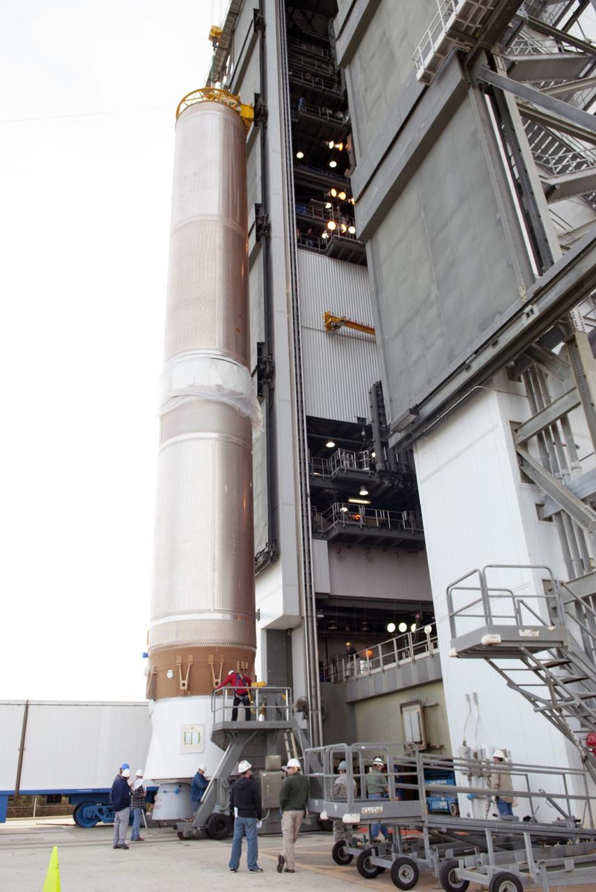 CAPE CANAVERAL, Fla. – At Cape Canaveral Air Force Station, the first stage of the United Launch Alliance Atlas V rocket is lifted for stacking in the Vertical Integration Facility at Launch Complex 41. The vehicle will be used to boost the Tracking and Data Relay Satellite, or TDRS-L, spacecraft to orbit. TDRS-L is the second of three next-generation satellites designed to ensure vital operational continuity for the NASA Space Network. It is scheduled to launch from Cape Canaveral's Space Launch Complex 41 atop an Atlas V rocket in January 2014. The current Tracking and Data Relay Satellite system consists of eight in-orbit satellites distributed to provide near continuous information relay service to missions such as the Hubble Space Telescope and International Space Station. For more information, visit: http://www.nasa.gov/content/tracking-and-data-relay-satellite-tdrs/ Photo credit: NASA/Charisse Nahser