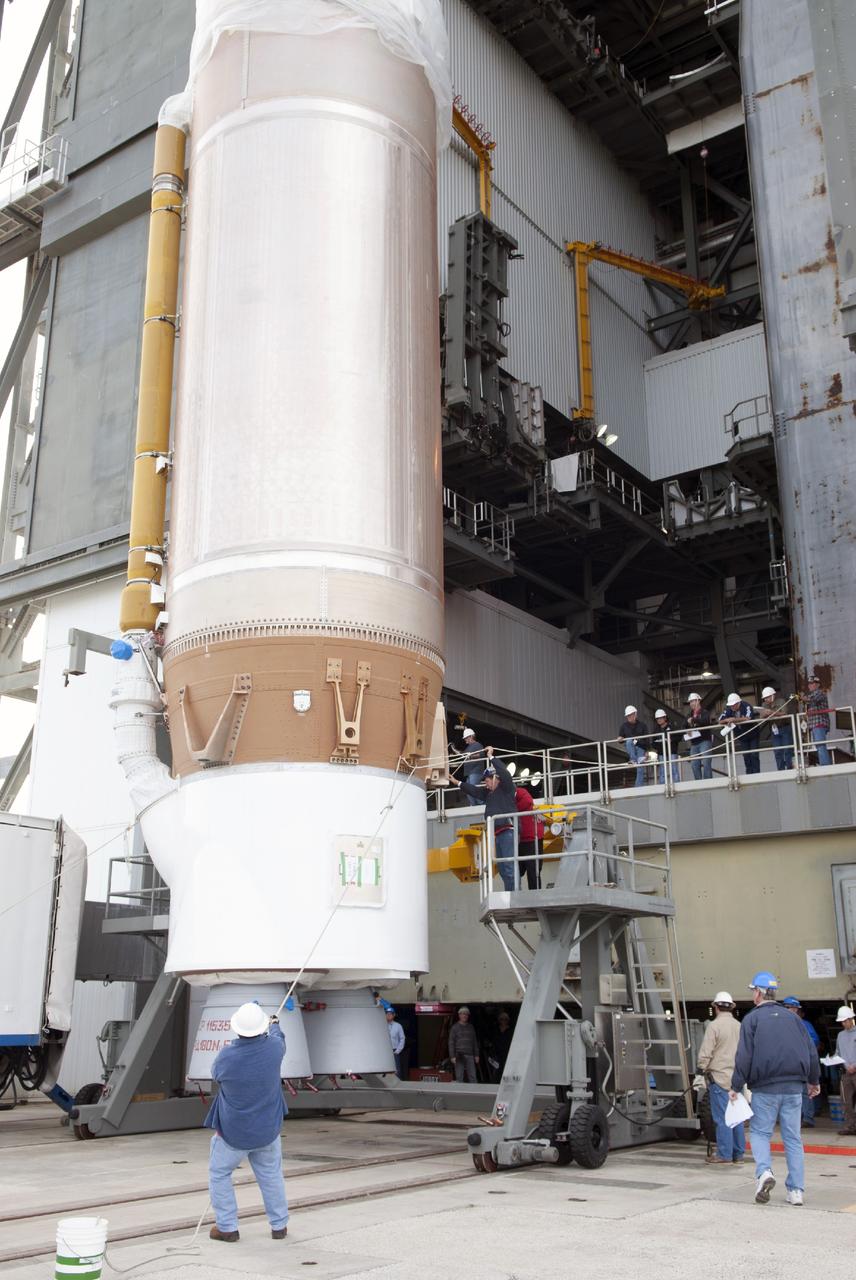 CAPE CANAVERAL, Fla. – At Cape Canaveral Air Force Station, engineers and technicians support lifting the first stage of the United Launch Alliance Atlas V rocket during stacking operations in the Vertical Integration Facility at Launch Complex 41. The vehicle will be used to boost the Tracking and Data Relay Satellite, or TDRS-L, spacecraft to orbit. TDRS-L is the second of three next-generation satellites designed to ensure vital operational continuity for the NASA Space Network. It is scheduled to launch from Cape Canaveral's Space Launch Complex 41 atop an Atlas V rocket in January 2014. The current Tracking and Data Relay Satellite system consists of eight in-orbit satellites distributed to provide near continuous information relay service to missions such as the Hubble Space Telescope and International Space Station. For more information, visit: http://www.nasa.gov/content/tracking-and-data-relay-satellite-tdrs/ Photo credit: NASA/Charisse Nahser
