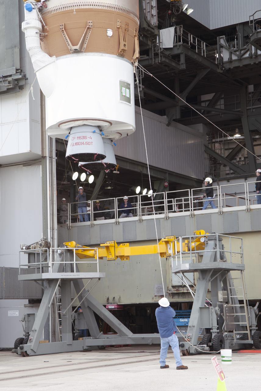 CAPE CANAVERAL, Fla. – At Cape Canaveral Air Force Station, a technician support lifting the first stage of the United Launch Alliance Atlas V rocket during stacking operations in the Vertical Integration Facility at Launch Complex 41. The vehicle will be used to boost the Tracking and Data Relay Satellite, or TDRS-L, spacecraft to orbit. TDRS-L is the second of three next-generation satellites designed to ensure vital operational continuity for the NASA Space Network. It is scheduled to launch from Cape Canaveral's Space Launch Complex 41 atop an Atlas V rocket in January 2014. The current Tracking and Data Relay Satellite system consists of eight in-orbit satellites distributed to provide near continuous information relay service to missions such as the Hubble Space Telescope and International Space Station. For more information, visit: http://www.nasa.gov/content/tracking-and-data-relay-satellite-tdrs/ Photo credit: NASA/Charisse Nahser