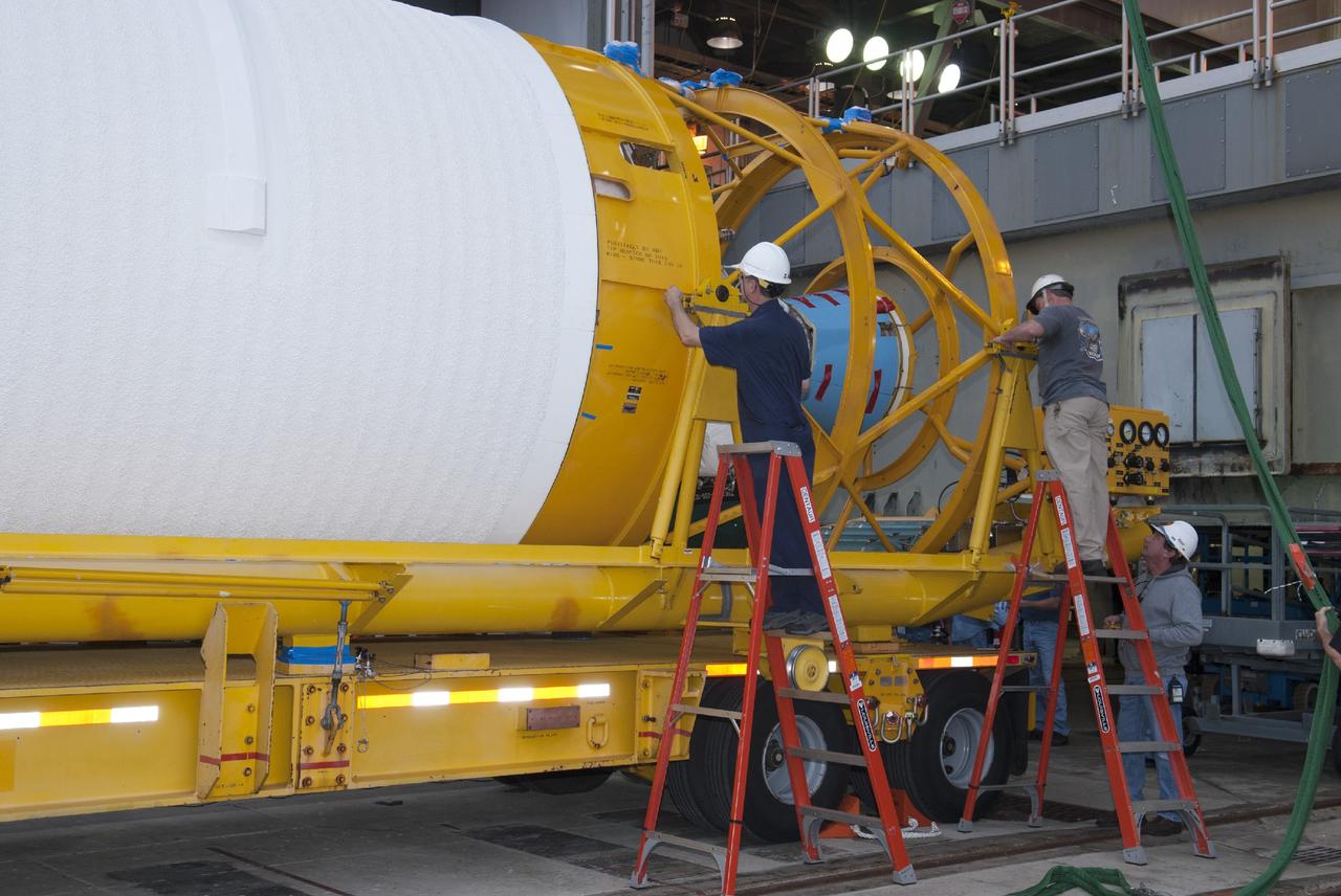 CAPE CANAVERAL, Fla. – At Cape Canaveral Air Force Station's Launch Complex 41, a technician supports preparations for lifting the Centaur second stage of the United Launch Alliance rocket that will be used to boost the Tracking and Data Relay Satellite, or TDRS-L, spacecraft to orbit. TDRS-L is the second of three next-generation satellites designed to ensure vital operational continuity for the NASA Space Network. It is scheduled to launch from Cape Canaveral's Space Launch Complex 41 atop an Atlas V rocket in January 2014. The current Tracking and Data Relay Satellite system consists of eight in-orbit satellites distributed to provide near continuous information relay service to missions such as the Hubble Space Telescope and International Space Station. For more information, visit: http://www.nasa.gov/content/tracking-and-data-relay-satellite-tdrs/ Photo credit: NASA/Charisse Nahser