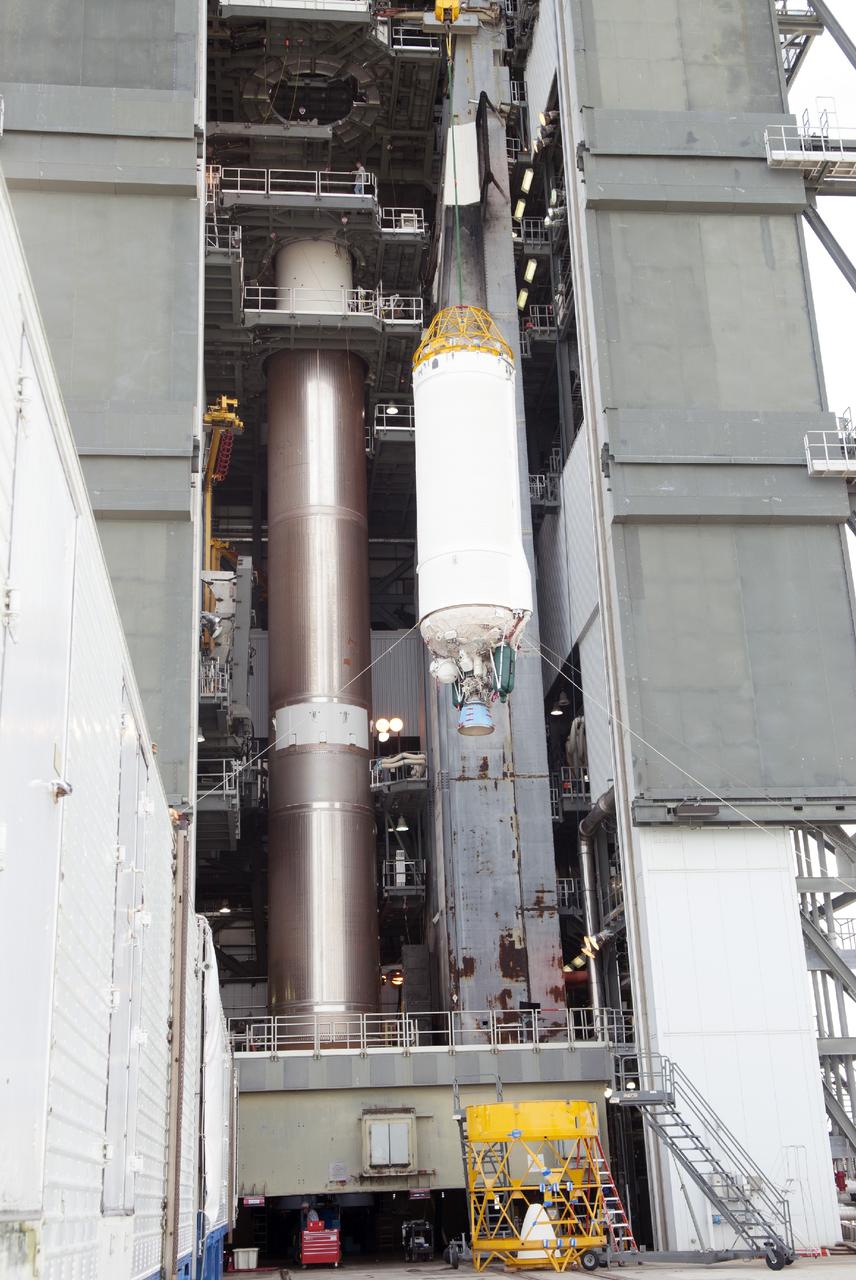 CAPE CANAVERAL, Fla. – At Cape Canaveral Air Force Station's Launch Complex 41, a Centaur second stage is lifted for stacking atop a United Launch Alliance Atlas V rocket that will be used to boost the Tracking and Data Relay Satellite, or TDRS-L, spacecraft to orbit. TDRS-L is the second of three next-generation satellites designed to ensure vital operational continuity for the NASA Space Network. It is scheduled to launch from Cape Canaveral's Space Launch Complex 41 atop an Atlas V rocket in January 2014. The current Tracking and Data Relay Satellite system consists of eight in-orbit satellites distributed to provide near continuous information relay service to missions such as the Hubble Space Telescope and International Space Station. For more information, visit: http://www.nasa.gov/content/tracking-and-data-relay-satellite-tdrs/ Photo credit: NASA/Charisse Nahser