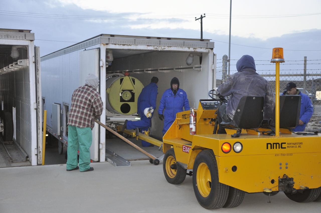 VANDENBERG AIR FORCE BASE, Calif. -- Personnel prepare to offload a solid rocket motor from its delivery truck following its arrival at Vandenberg Air Force Base in California. The motor will be attached to the United Launch Alliance Delta II rocket slated to launch NASA's Orbiting Carbon Observatory-2, or OCO-2, spacecraft in July 2014.      OCO-2 will collect precise global measurements of carbon dioxide  in the Earth's atmosphere. Scientists will analyze this data to improve our understanding of the natural processes and human activities that regulate the abundance and distribution of this important atmospheric gas.  Photo credit: NASA/Randy Beaudoin