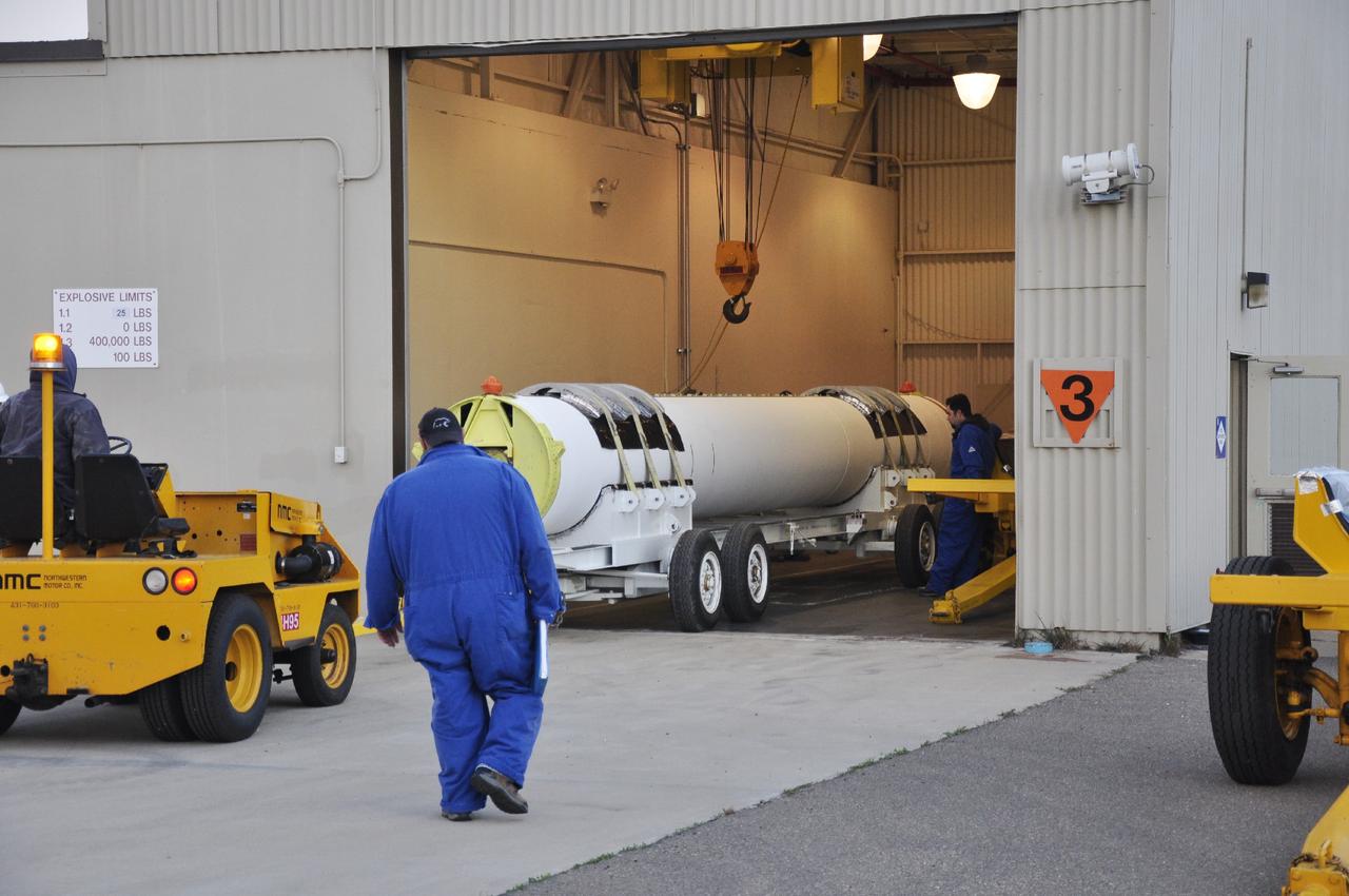VANDENBERG AIR FORCE BASE, Calif. -- A solid rocket motor is rolled into the Solid Rocket Motor Processing Facility at Vandenberg Air Force Base in California. The motor will be attached to the United Launch Alliance Delta II rocket slated to launch NASA's Orbiting Carbon Observatory-2, or OCO-2, spacecraft in July 2014.    OCO-2 will collect precise global measurements of carbon dioxide  in the Earth's atmosphere. Scientists will analyze this data to improve our understanding of the natural processes and human activities that regulate the abundance and distribution of this important atmospheric gas.  Photo credit: NASA/Randy Beaudoin