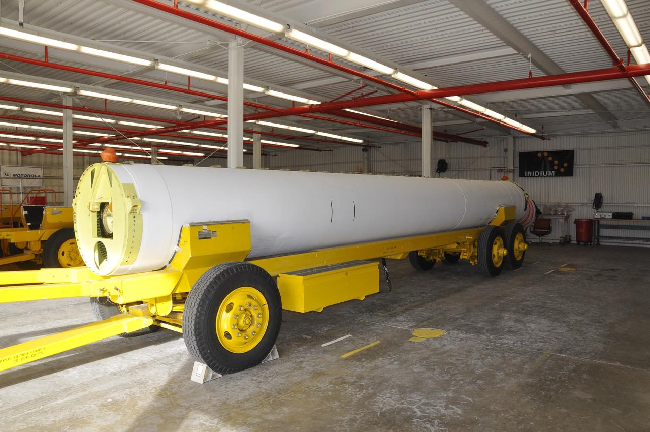 VANDENBERG AIR FORCE BASE, Calif. -- A solid rocket motor sits on a transporter inside the Solid Rocket Motor Processing Facility at Vandenberg Air Force Base in California. The motor will be attached to the United Launch Alliance Delta II rocket slated to launch NASA's Orbiting Carbon Observatory-2, or OCO-2, spacecraft in July 2014. OCO-2 will collect precise global measurements of carbon dioxide in the Earth's atmosphere. Scientists will analyze this data to improve our understanding of the natural processes and human activities that regulate the abundance and distribution of this important atmospheric gas. Photo credit: NASA/Randy Beaudoin