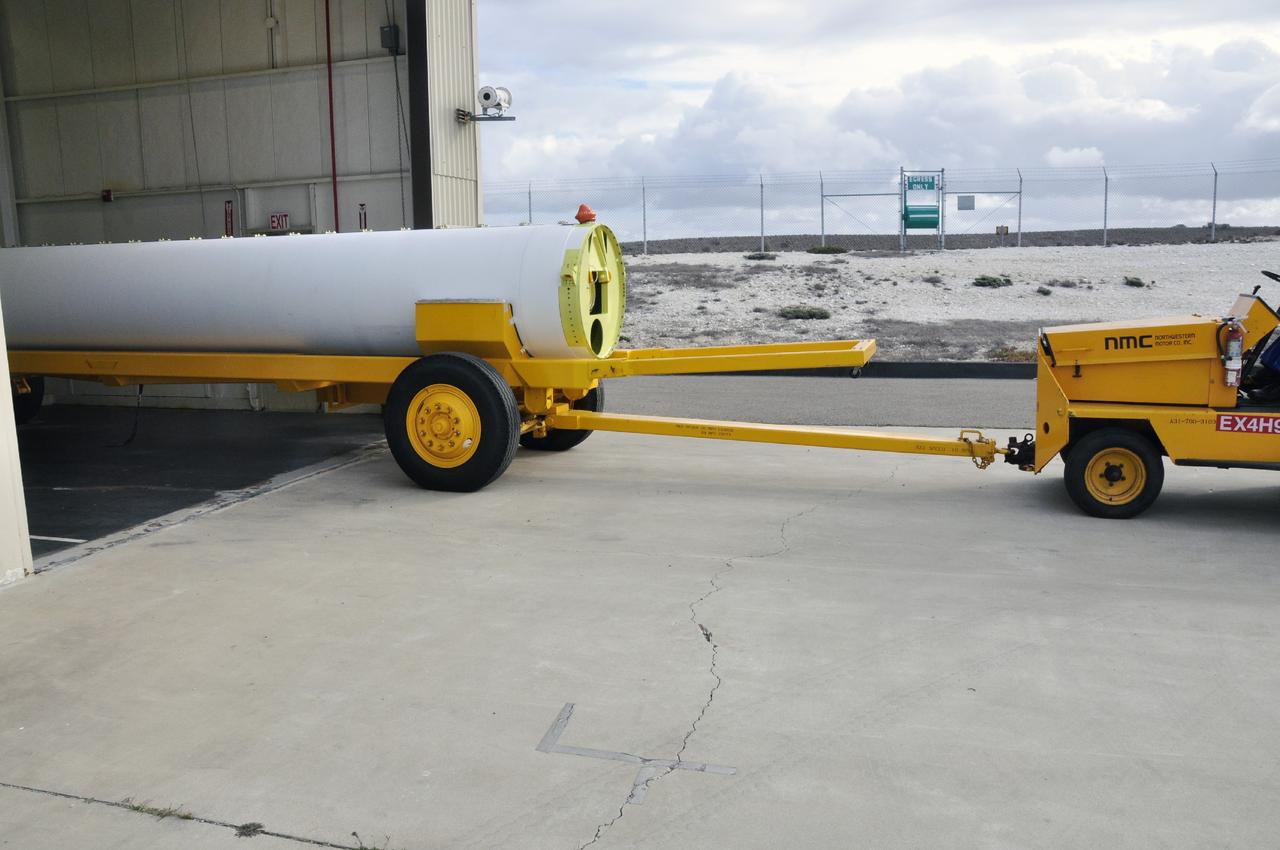 VANDENBERG AIR FORCE BASE, Calif. -- A solid rocket motor is moved on a transporter to the Solid Rocket Motor Processing Facility at Vandenberg Air Force Base in California. The motor will be attached to the United Launch Alliance Delta II rocket slated to launch NASA's Orbiting Carbon Observatory-2, or OCO-2, spacecraft in July 2014. OCO-2 will collect precise global measurements of carbon dioxide in the Earth's atmosphere. Scientists will analyze this data to improve our understanding of the natural processes and human activities that regulate the abundance and distribution of this important atmospheric gas. Photo credit: NASA/Randy Beaudoin