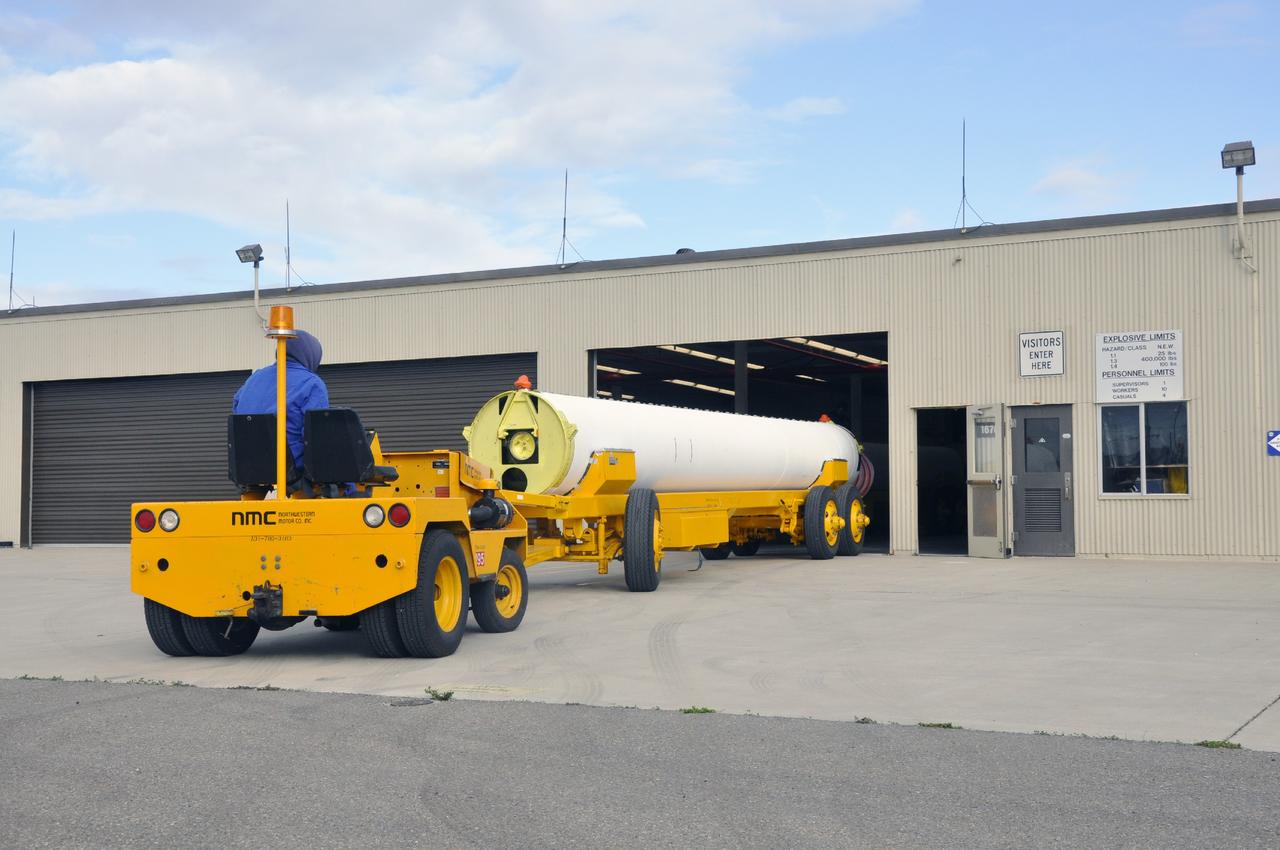 VANDENBERG AIR FORCE BASE, Calif. -- A solid rocket motor is moved on a transporter to the Solid Rocket Motor Processing Facility at Vandenberg Air Force Base in California. The motor will be attached to the United Launch Alliance Delta II rocket slated to launch NASA's Orbiting Carbon Observatory-2, or OCO-2, spacecraft in July 2014. OCO-2 will collect precise global measurements of carbon dioxide in the Earth's atmosphere. Scientists will analyze this data to improve our understanding of the natural processes and human activities that regulate the abundance and distribution of this important atmospheric gas. Photo credit: NASA/Randy Beaudoin
