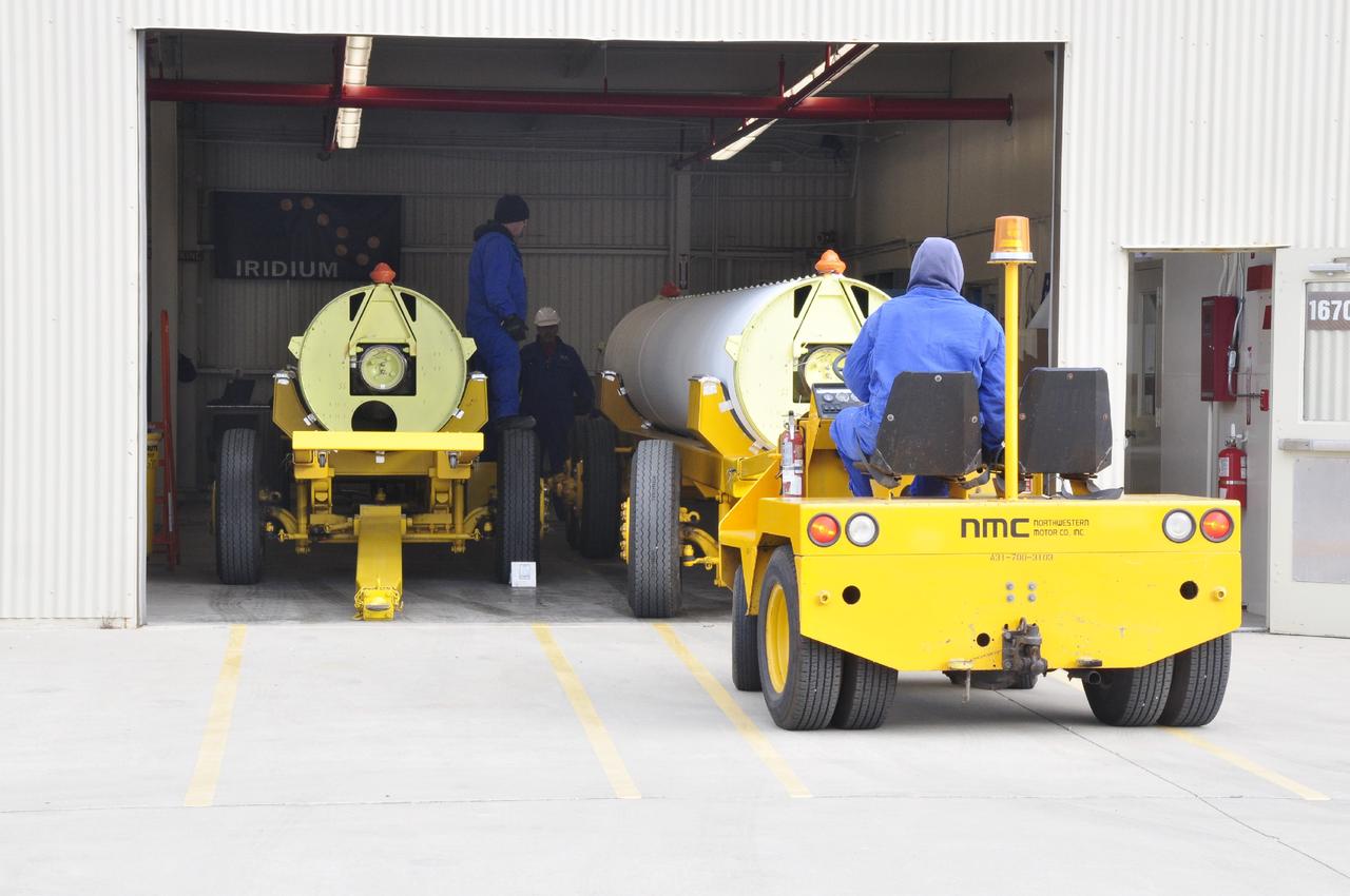 VANDENBERG AIR FORCE BASE, Calif. -- A solid rocket motor is moved on a transporter to the Solid Rocket Motor Processing Facility at Vandenberg Air Force Base in California. The motor will be attached to the United Launch Alliance Delta II rocket slated to launch NASA's Orbiting Carbon Observatory-2, or OCO-2, spacecraft in July 2014. OCO-2 will collect precise global measurements of carbon dioxide in the Earth's atmosphere. Scientists will analyze this data to improve our understanding of the natural processes and human activities that regulate the abundance and distribution of this important atmospheric gas. Photo credit: NASA/Randy Beaudoin