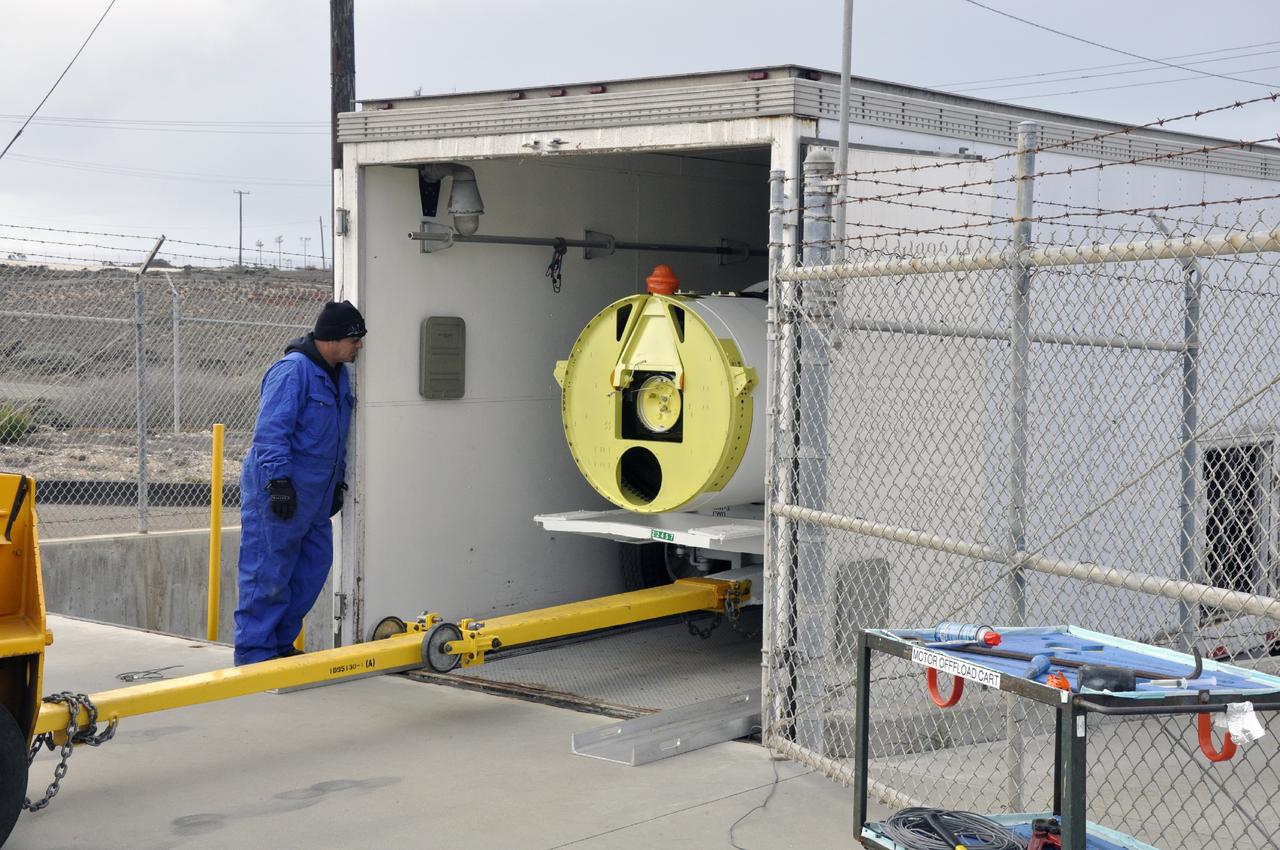 VANDENBERG AIR FORCE BASE, Calif. -- A solid rocket motor is moved on a transporter to the Solid Rocket Motor Processing Facility at Vandenberg Air Force Base in California. The motor will be attached to the United Launch Alliance Delta II rocket slated to launch NASA's Orbiting Carbon Observatory-2, or OCO-2, spacecraft in July 2014. OCO-2 will collect precise global measurements of carbon dioxide in the Earth's atmosphere. Scientists will analyze this data to improve our understanding of the natural processes and human activities that regulate the abundance and distribution of this important atmospheric gas. Photo credit: NASA/Randy Beaudoin