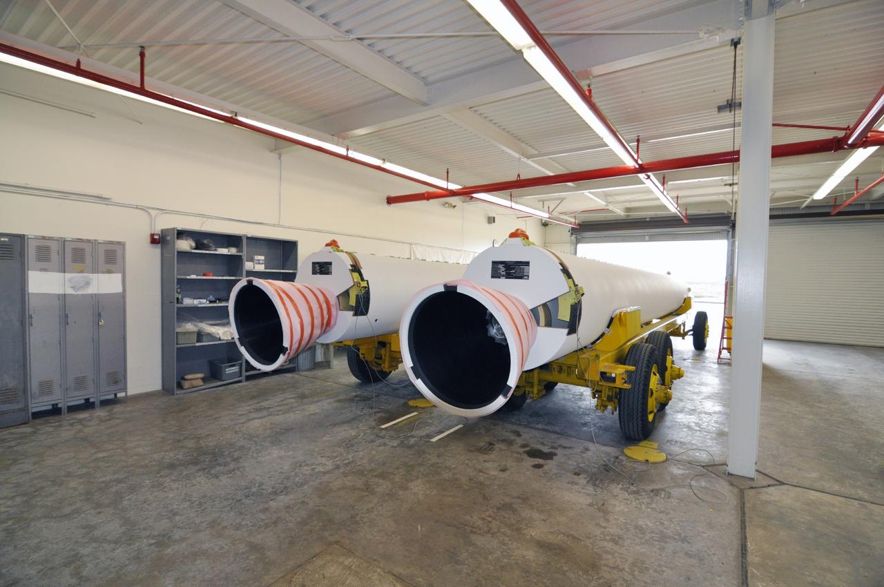 VANDENBERG AIR FORCE BASE, Calif. – A pair of solid rocket motors on transporters inside the Solid Rocket Motor Processing Facility at Vandenberg Air Force Base in California. The motors will be attached to the United Launch Alliance Delta II rocket slated to launch NASA's Orbiting Carbon Observatory-2, or OCO-2, spacecraft in July 2014. OCO-2 will collect precise global measurements of carbon dioxide in the Earth's atmosphere. Scientists will analyze this data to improve our understanding of the natural processes and human activities that regulate the abundance and distribution of this important atmospheric gas. Photo credit: NASA/Randy Beaudoin