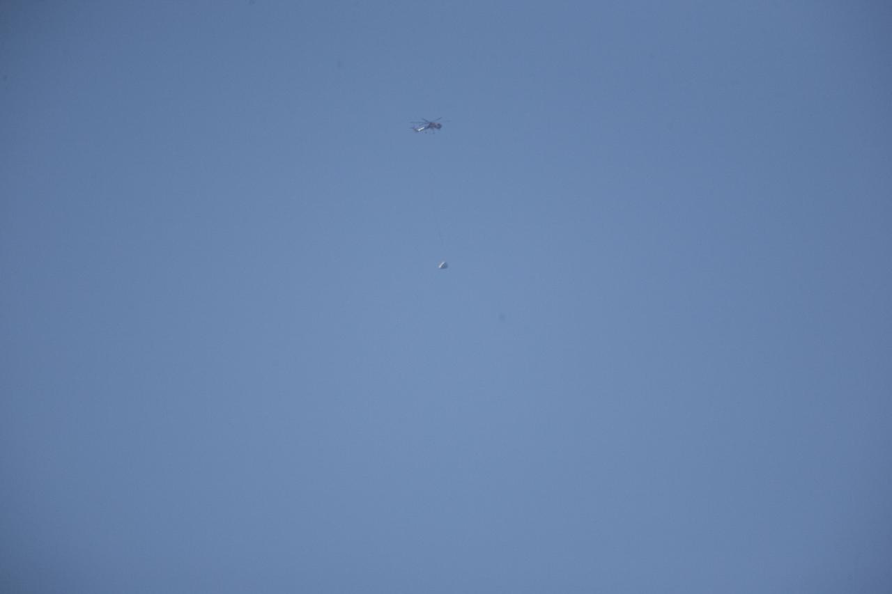MORRO BAY, Calif. – An Erickson Sky Crane helicopter releases the SpaceX Dragon test article, inducing a tumble similar to what is expected in an emergency abort scenario, over the Pacific Ocean, off the coast of Morro Bay, Calif. The  test allowed engineers to better evaluate the spacecraft's parachute deployment system as part of a milestone under its Commercial Crew Integrated Capability agreement with NASA's Commercial Crew Program. Photo credit: NASA/Kim Shiflett