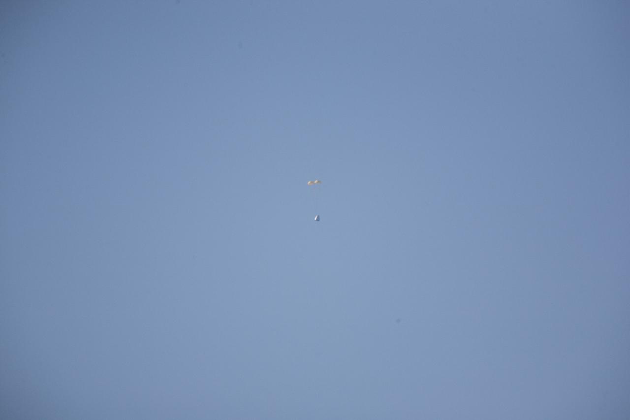 MORRO BAY, Calif. – Drogue chutes open above Dragon test article during a test to evaluate the spacecraft's parachute deployment system. The drogue chutes stabilized the vehicle, in preparation for main chute deployment as part of a milestone under SpaceX's Commercial Crew Integrated Capability agreement with NASA's Commercial Crew Program. Photo credit: NASA/Kim Shiflett