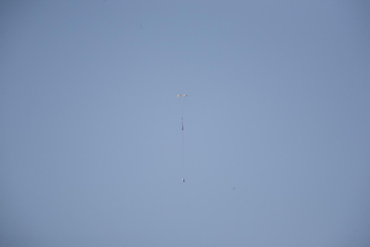 MORRO BAY, Calif. – The main parachutes begin to unfurl above mockup Dragon test article during a test over the Pacific Ocean, off the coast of Morro Bay, Calif., to evaluate the spacecraft's parachute deployment system. The test was part of a milestone under SpaceX's Commercial Crew Integrated Capability agreement with NASA's Commercial Crew Program. Photo credit: NASA/Kim Shiflett