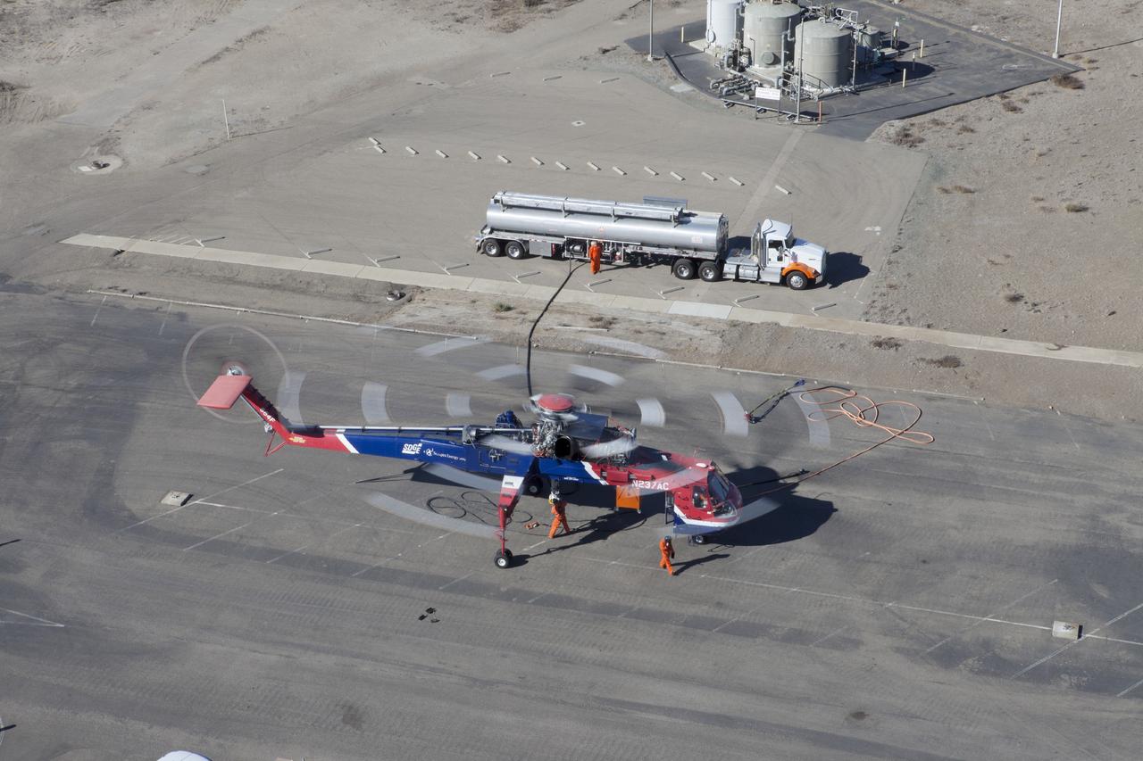 MORRO BAY, Calif. – An Erickson Sky Crane helicopter refuels following splash down of SpaceX Dragon test article. The test enables SpaceX engineers to evaluate the spacecraft's parachute deployment system as part of a milestone under its Commercial Crew Integrated Capability agreement with NASA's Commercial Crew Program. The parachute test took place at Morro Bay, Calif. Photo credit: NASA/Kim Shiflett