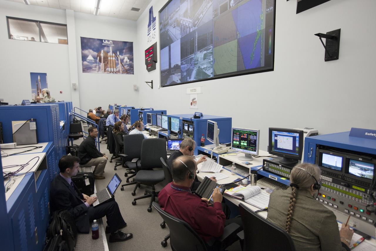 CAPE CANAVERAL, Fla. – At Cape Canaveral Air Force Station's Atlas V Spaceflight Operations Center NASA and contractor managers and engineers monitor progress of the countdown for the launch the agency's Mars Atmosphere and Volatile Evolution, or MAVEN, spacecraft.    MAVEN was launched on Nov. 18, 2013 from Cape Canaveral's Space Launch Complex 41 atop a United Launch Alliance Atlas V rocket. Positioned in an orbit above the Red Planet, MAVEN will study the upper atmosphere of Mars in unprecedented detail. For more information, visit: http://www.nasa.gov/mission_pages/maven/main/index.html Photo credit: NASA/Kim Shiflett