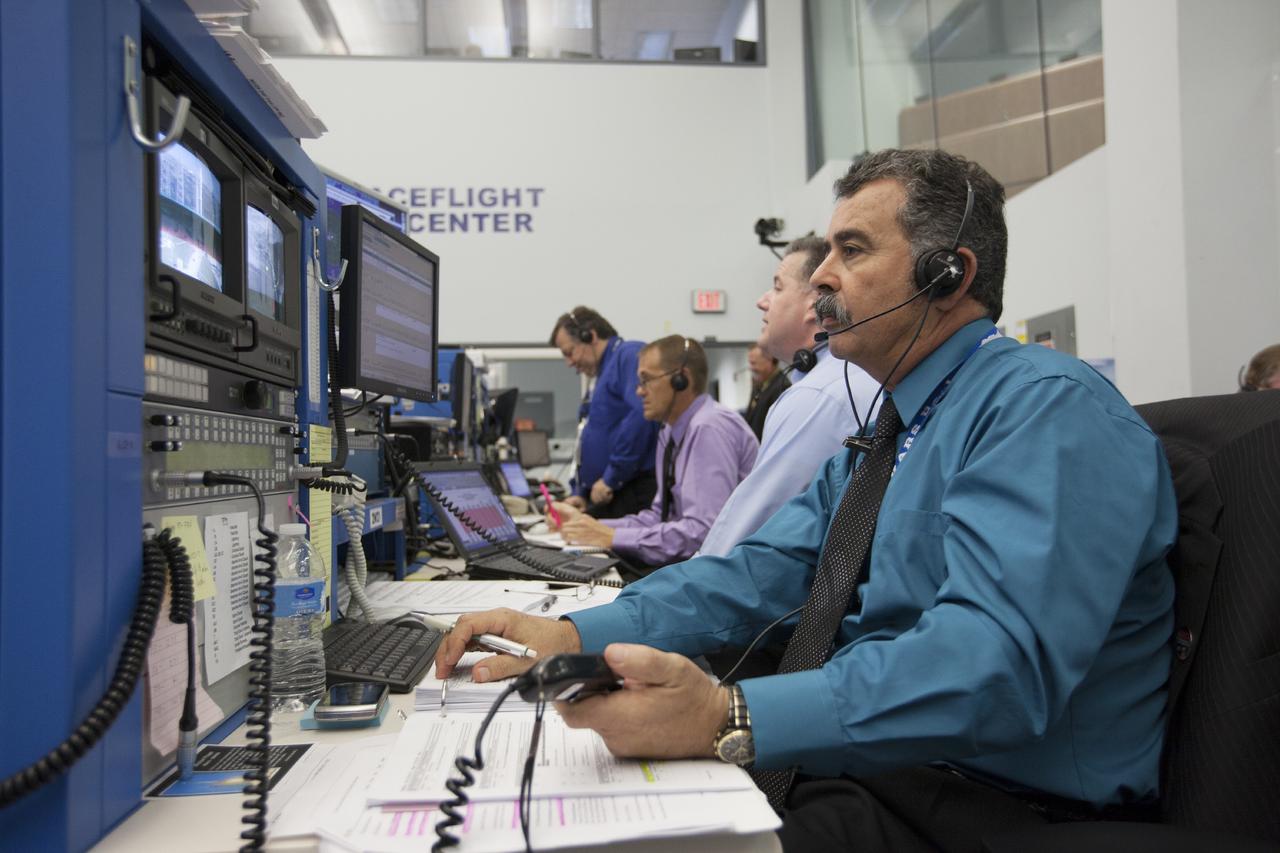 CAPE CANAVERAL, Fla. – At Cape Canaveral Air Force Station's Atlas V Spaceflight Operations Center NASA and contractor managers and engineers monitor progress of the countdown for the launch the agency's Mars Atmosphere and Volatile Evolution, or MAVEN, spacecraft.    MAVEN was launched on Nov. 18, 2013 from Cape Canaveral's Space Launch Complex 41 atop a United Launch Alliance Atlas V rocket. Positioned in an orbit above the Red Planet, MAVEN will study the upper atmosphere of Mars in unprecedented detail. For more information, visit: http://www.nasa.gov/mission_pages/maven/main/index.html Photo credit: NASA/Kim Shiflett