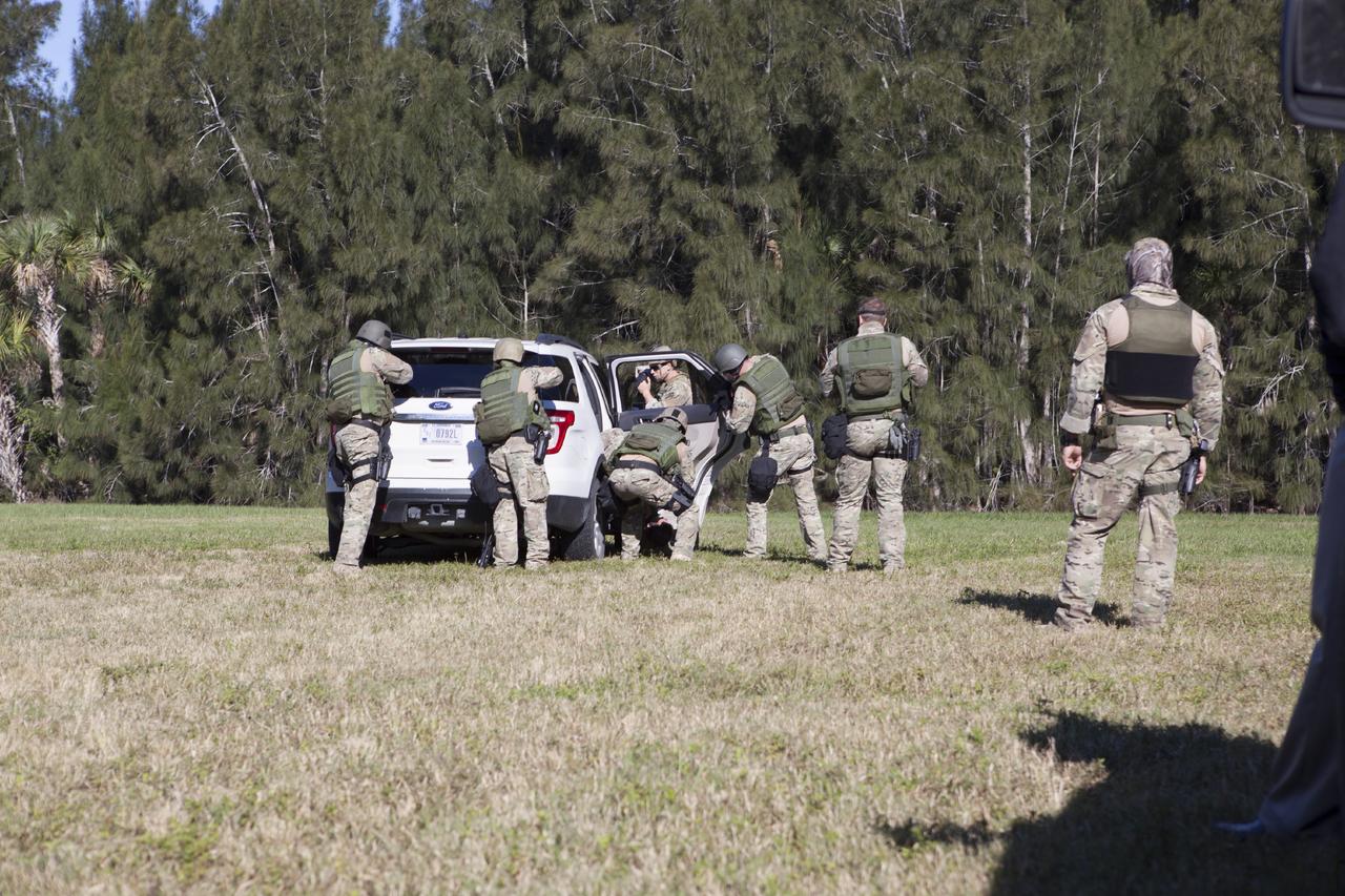 CAPE CANAVERAL, Fla. – At NASA’s Protective Services Training Academy at Kennedy Space Center in Florida, members of the Emergency Response Team, or ERT, participate in specialized training simulations in order to keep their skills current. They are wearing full protective gear and carrying non-lethal firearms for the training exercises.    Recently, eight members of the ERT competed in the 31st Annual SWAT Roundup International competition in Orlando, Fla., and received recognition by placing in the top five overall.  In keeping with NASA’s commitment to safety and security of workforce and assets, the ERT is part of Kennedy’s security team and is trained to respond in the event of an emergency at the center.  Photo credit: NASA/Dimitri Gerondidakis