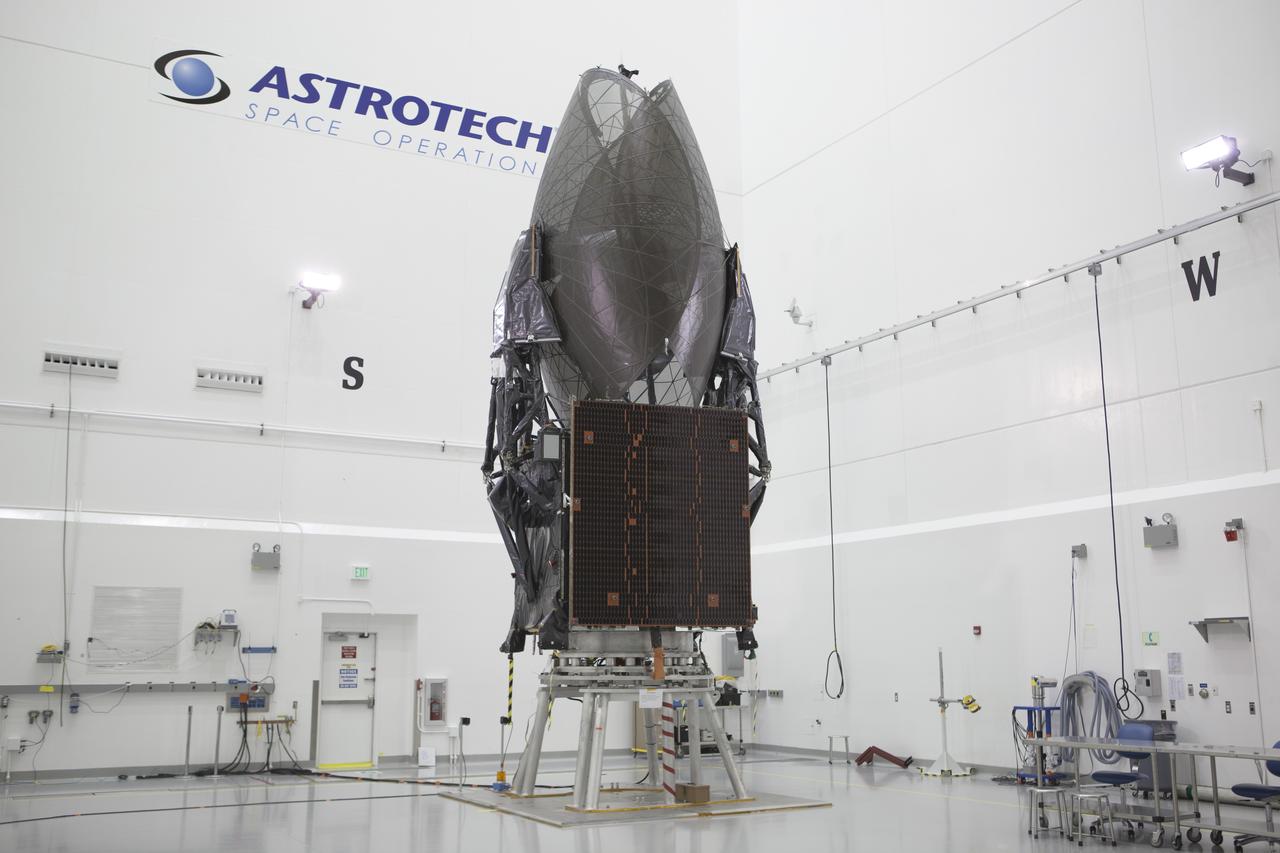 TITUSVILLE, Fla. – Members of the news media are given an opportunity for an up-close look at the Tracking and Data Relay Satellite, or TDRS-L, spacecraft undergoing preflight processing inside the Astrotech payload processing facility in Titusville. TDRS-L is being prepared for encapsulation inside its payload fairing prior to being transported to Launch Complex 41 at Cape Canaveral Air Force Station. Journalists visited Astrotech as part of TDRS-L Media Day to conduct interviews and photograph the satellite that will be a part of the second of three next-generation spacecraft designed to ensure vital operational continuity for the NASA Space Network. It is scheduled to launch from Cape Canaveral's Space Launch Complex 41 atop an Atlas V rocket in January 2014. The current Tracking and Data Relay Satellite system consists of eight in-orbit satellites distributed to provide near continuous information relay contact with orbiting spacecraft ranging from the International Space Station and Hubble Space Telescope to the array of scientific observatories. For more information, visit: http://www.nasa.gov/mission_pages/tdrs/home/index.html