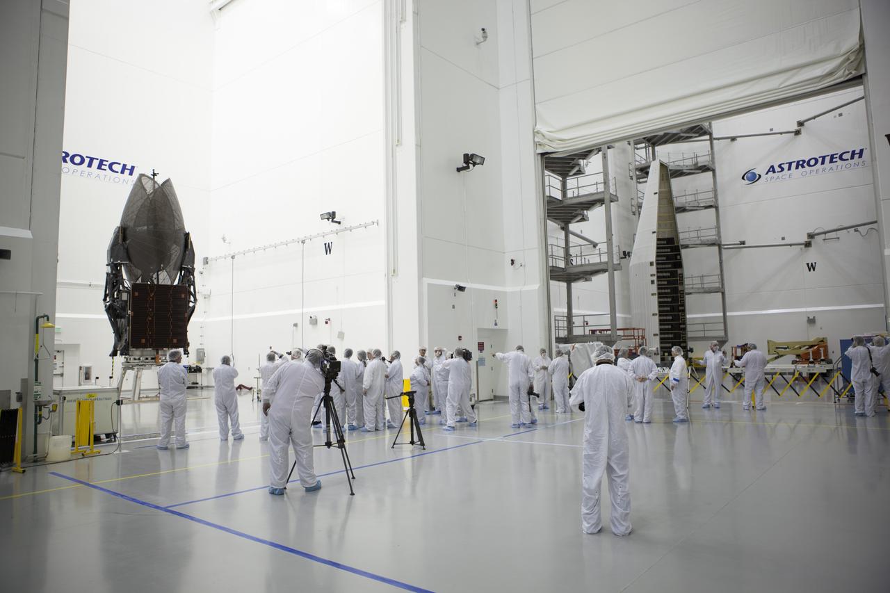 TITUSVILLE, Fla. – Members of the news media are given an up-close look at the Tracking and Data Relay Satellite, or TDRS-L, spacecraft undergoing preflight processing inside the Astrotech payload processing facility in Titusville. TDRS-L is being prepared for encapsulation inside its payload fairing prior to being transported to Launch Complex 41 at Cape Canaveral Air Force Station. Journalists visited Astrotech as part of TDRS-L Media Day to conduct interviews and photograph the satellite that will be a part of the second of three next-generation spacecraft designed to ensure vital operational continuity for the NASA Space Network. It is scheduled to launch from Cape Canaveral's Space Launch Complex 41 atop an Atlas V rocket in January 2014. The current Tracking and Data Relay Satellite system consists of eight in-orbit satellites distributed to provide near continuous information relay contact with orbiting spacecraft ranging from the International Space Station and Hubble Space Telescope to the array of scientific observatories. For more information, visit: http://www.nasa.gov/mission_pages/tdrs/home/index.html