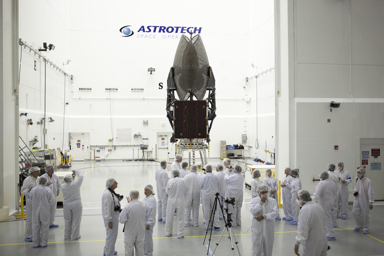 TITUSVILLE, Fla. – Members of the news media are given an up-close look at the Tracking and Data Relay Satellite, or TDRS-L, spacecraft undergoing preflight processing inside the Astrotech payload processing facility in Titusville. TDRS-L is being prepared for encapsulation inside its payload fairing prior to being transported to Launch Complex 41 at Cape Canaveral Air Force Station. Journalists visited Astrotech as part of TDRS-L Media Day to conduct interviews and photograph the satellite that will be a part of the second of three next-generation spacecraft designed to ensure vital operational continuity for the NASA Space Network. It is scheduled to launch from Cape Canaveral's Space Launch Complex 41 atop an Atlas V rocket in January 2014. The current Tracking and Data Relay Satellite system consists of eight in-orbit satellites distributed to provide near continuous information relay contact with orbiting spacecraft ranging from the International Space Station and Hubble Space Telescope to the array of scientific observatories. For more information, visit: http://www.nasa.gov/mission_pages/tdrs/home/index.html