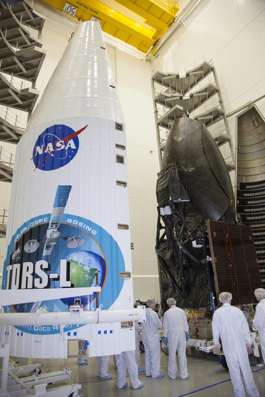 TITUSVILLE, Fla. – Inside the Astrotech payload processing facility in Titusville, the Tracking and Data Relay Satellite, or TDRS-L, spacecraft is being encapsulated in its payload fairing in preparation for being transported to Launch Complex 41 at Cape Canaveral Air Force Station. The TDRS-L satellite will be a part of the second of three next-generation spacecraft designed to ensure vital operational continuity for the NASA Space Network. It is scheduled to launch from Cape Canaveral's Space Launch Complex 41 atop a United Launch Alliance Atlas V rocket on January 23, 2014. The current Tracking and Data Relay Satellite system consists of eight in-orbit satellites distributed to provide near continuous information relay contact with orbiting spacecraft ranging from the International Space Station and Hubble Space Telescope to the array of scientific observatories. For more information, visit: http://www.nasa.gov/mission_pages/tdrs/home/index.html