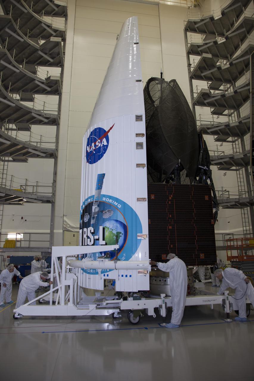 TITUSVILLE, Fla. – Inside the Astrotech payload processing facility in Titusville, the Tracking and Data Relay Satellite, or TDRS-L, spacecraft is being encapsulated in its payload fairing in preparation for begin transported to Launch Complex 41 at Cape Canaveral Air Force Station. The TDRS-L satellite will be a part of the second of three next-generation spacecraft designed to ensure vital operational continuity for the NASA Space Network. It is scheduled to launch from Cape Canaveral's Space Launch Complex 41 atop a United Launch Alliance Atlas V rocket on January 23, 2014. The current Tracking and Data Relay Satellite system consists of eight in-orbit satellites distributed to provide near continuous information relay contact with orbiting spacecraft ranging from the International Space Station and Hubble Space Telescope to the array of scientific observatories. For more information, visit: http://www.nasa.gov/mission_pages/tdrs/home/index.html