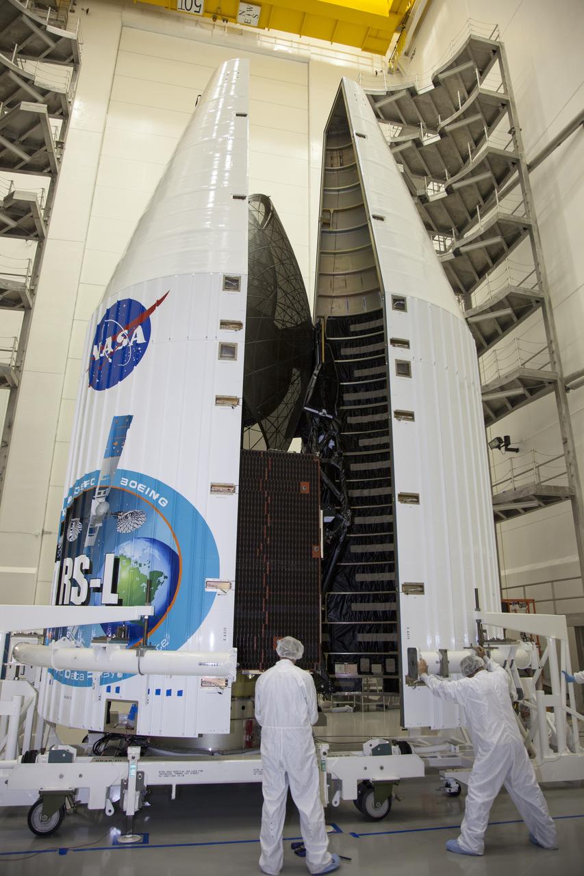 TITUSVILLE, Fla. – Inside the Astrotech payload processing facility in Titusville, United Launch Alliance engineers and technicians encapsulate the Tracking and Data Relay Satellite, or TDRS-L, spacecraft in its payload fairing. TDRS-L will then be transported to Launch Complex 41 at Cape Canaveral Air Force Station. The TDRS-L satellite will be a part of the second of three next-generation spacecraft designed to ensure vital operational continuity for the NASA Space Network. It is scheduled to launch from Cape Canaveral's Space Launch Complex 41 atop a United Launch Alliance Atlas V rocket on January 23, 2014. The current Tracking and Data Relay Satellite system consists of eight in-orbit satellites distributed to provide near continuous information relay contact with orbiting spacecraft ranging from the International Space Station and Hubble Space Telescope to the array of scientific observatories. For more information, visit: http://www.nasa.gov/mission_pages/tdrs/home/index.html