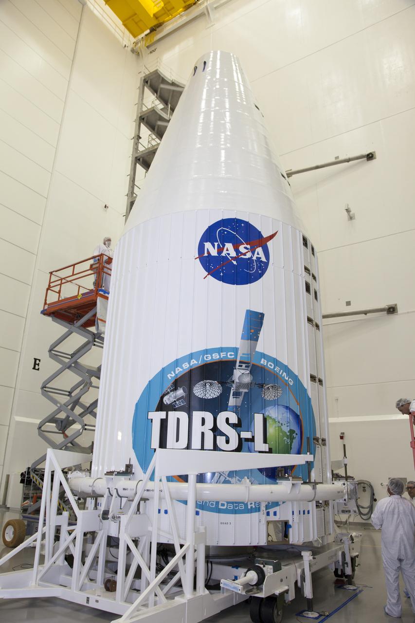 TITUSVILLE, Fla. – Inside the Astrotech payload processing facility in Titusville, NASA's Tracking and Data Relay Satellite, or TDRS-L, spacecraft has been encapsulated in its payload fairing. TDRS-L will then be transported to Launch Complex 41 at Cape Canaveral Air Force Station. The TDRS-L satellite will be a part of the second of three next-generation spacecraft designed to ensure vital operational continuity for the NASA Space Network. It is scheduled to launch from Cape Canaveral's Space Launch Complex 41 atop a United Launch Alliance Atlas V rocket on January 23, 2014. The current Tracking and Data Relay Satellite system consists of eight in-orbit satellites distributed to provide near continuous information relay contact with orbiting spacecraft ranging from the International Space Station and Hubble Space Telescope to the array of scientific observatories. For more information, visit: http://www.nasa.gov/mission_pages/tdrs/home/index.html
