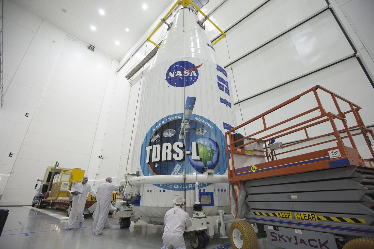 TITUSVILLE, Fla. – Under the watchful eyes of United launch Alliance engineers and technicians at the Astrotech payload processing facility in Titusville, the Tracking and Data Relay Satellite, or TDRS-L, spacecraft is being encapsulated in its payload fairing. It is about to be lifted by crane for mounting on a transporter for its trip to Launch Complex 41 at Cape Canaveral Air Force Station. The TDRS-L satellite will be a part of the second of three next-generation spacecraft designed to ensure vital operational continuity for the NASA Space Network. It is scheduled to launch from Cape Canaveral's Space Launch Complex 41 atop a United Launch Alliance Atlas V rocket on January 23, 2014. The current Tracking and Data Relay Satellite system consists of eight in-orbit satellites distributed to provide near continuous information relay contact with orbiting spacecraft ranging from the International Space Station and Hubble Space Telescope to the array of scientific observatories. For more information, visit: http://www.nasa.gov/mission_pages/tdrs/home/index.html Photo credit: NASA/Kim Shiflett