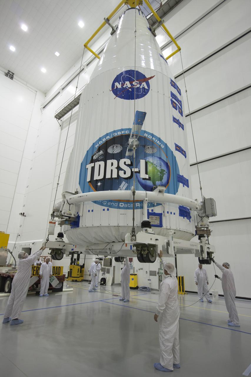 TITUSVILLE, Fla. – Inside the Astrotech payload processing facility in Titusville, NASA's Tracking and Data Relay Satellite, or TDRS-L, spacecraft has been encapsulated in its payload fairing. It is being lifted by crane for mounting on a transporter for its trip to Launch Complex 41 at Cape Canaveral Air Force Station. The TDRS-L satellite will be a part of the second of three next-generation spacecraft designed to ensure vital operational continuity for the NASA Space Network. It is scheduled to launch from Cape Canaveral's Space Launch Complex 41 atop a United Launch Alliance Atlas V rocket on January 23, 2014. The current Tracking and Data Relay Satellite system consists of eight in-orbit satellites distributed to provide near continuous information relay contact with orbiting spacecraft ranging from the International Space Station and Hubble Space Telescope to the array of scientific observatories. For more information, visit: http://www.nasa.gov/mission_pages/tdrs/home/index.html Photo credit: NASA/Kim Shiflett