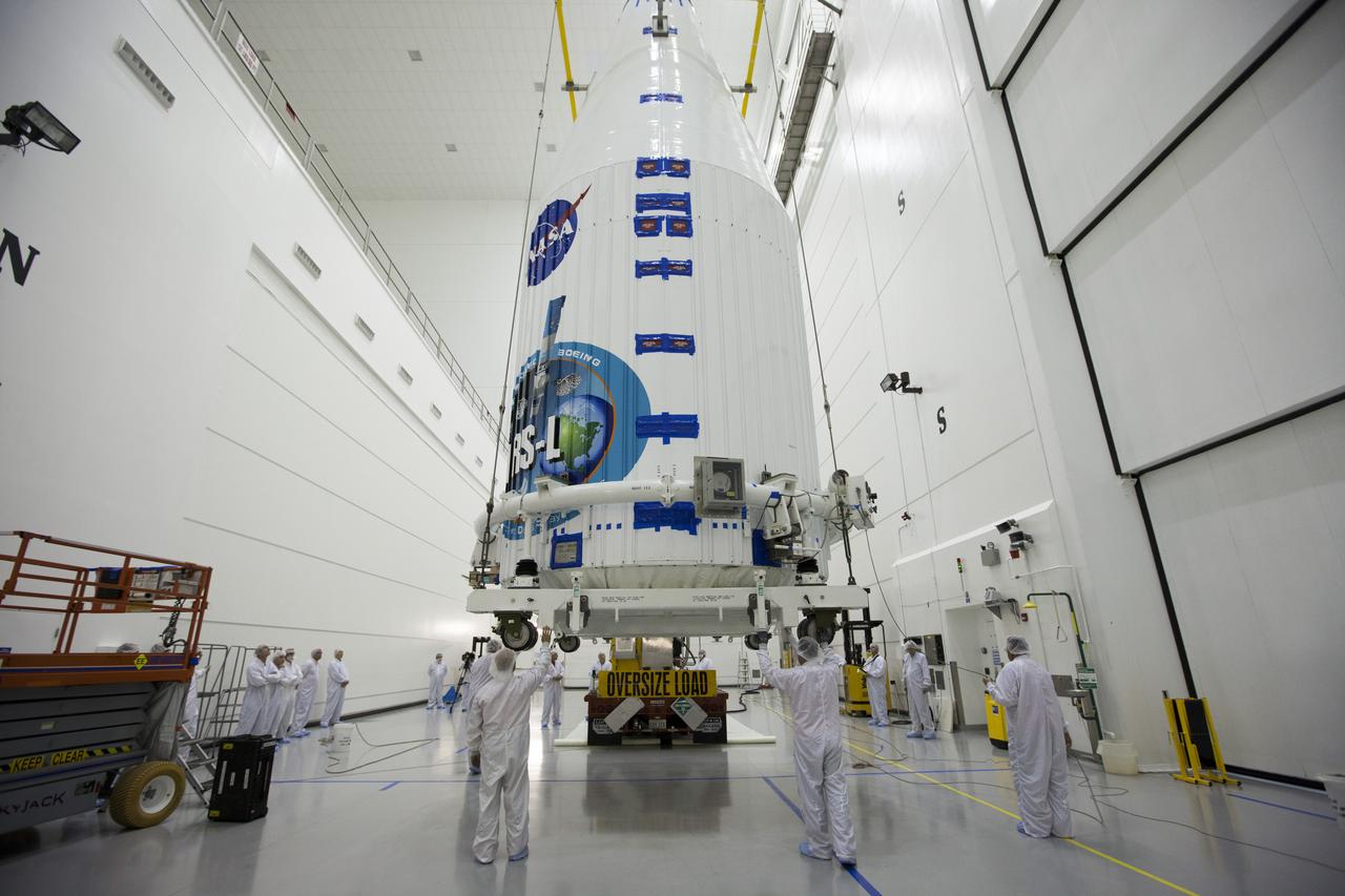 TITUSVILLE, Fla. – Inside the Astrotech payload processing facility in Titusville, NASA's Tracking and Data Relay Satellite, or TDRS-L, spacecraft has been encapsulated in its payload fairing. It is being lifted by crane for mounting on a transporter for its trip to Launch Complex 41 at Cape Canaveral Air Force Station. The TDRS-L satellite will be a part of the second of three next-generation spacecraft designed to ensure vital operational continuity for the NASA Space Network. It is scheduled to launch from Cape Canaveral's Space Launch Complex 41 atop a United Launch Alliance Atlas V rocket on January 23, 2014. The current Tracking and Data Relay Satellite system consists of eight in-orbit satellites distributed to provide near continuous information relay contact with orbiting spacecraft ranging from the International Space Station and Hubble Space Telescope to the array of scientific observatories. For more information, visit: http://www.nasa.gov/mission_pages/tdrs/home/index.html Photo credit: NASA/Kim Shiflett