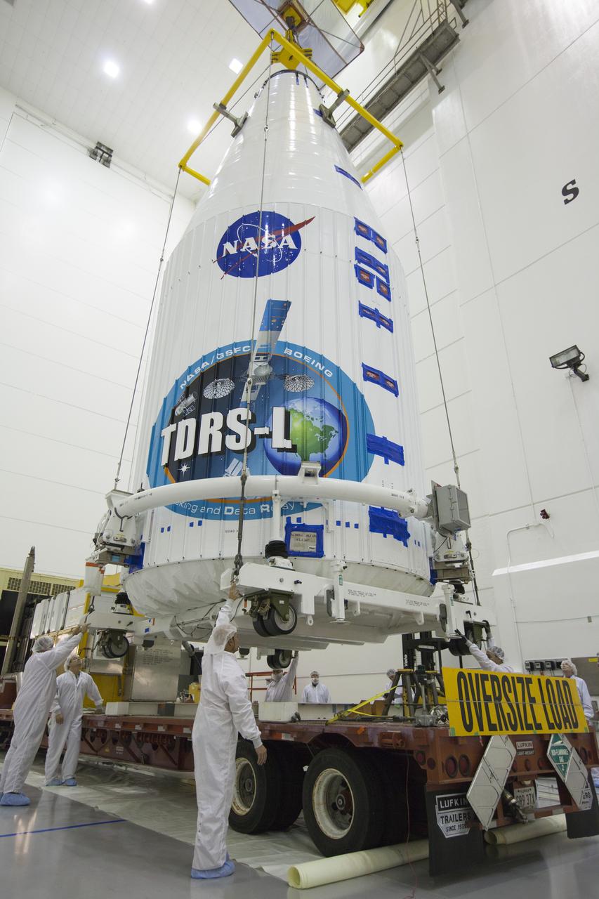 TITUSVILLE, Fla. – Inside the Astrotech payload processing facility in Titusville, NASA's Tracking and Data Relay Satellite, or TDRS-L, spacecraft has been encapsulated in its payload fairing. It is being lifted by crane for mounting on a transporter for its trip to Launch Complex 41 at Cape Canaveral Air Force Station. The TDRS-L satellite will be a part of the second of three next-generation spacecraft designed to ensure vital operational continuity for the NASA Space Network. It is scheduled to launch from Cape Canaveral's Space Launch Complex 41 atop a United Launch Alliance Atlas V rocket on January 23, 2014. The current Tracking and Data Relay Satellite system consists of eight in-orbit satellites distributed to provide near continuous information relay contact with orbiting spacecraft ranging from the International Space Station and Hubble Space Telescope to the array of scientific observatories. For more information, visit: http://www.nasa.gov/mission_pages/tdrs/home/index.html Photo credit: NASA/Kim Shiflett