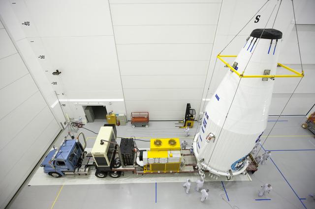 NASA image: TDRS-L Spacecraft is Lifted Onto Transporter