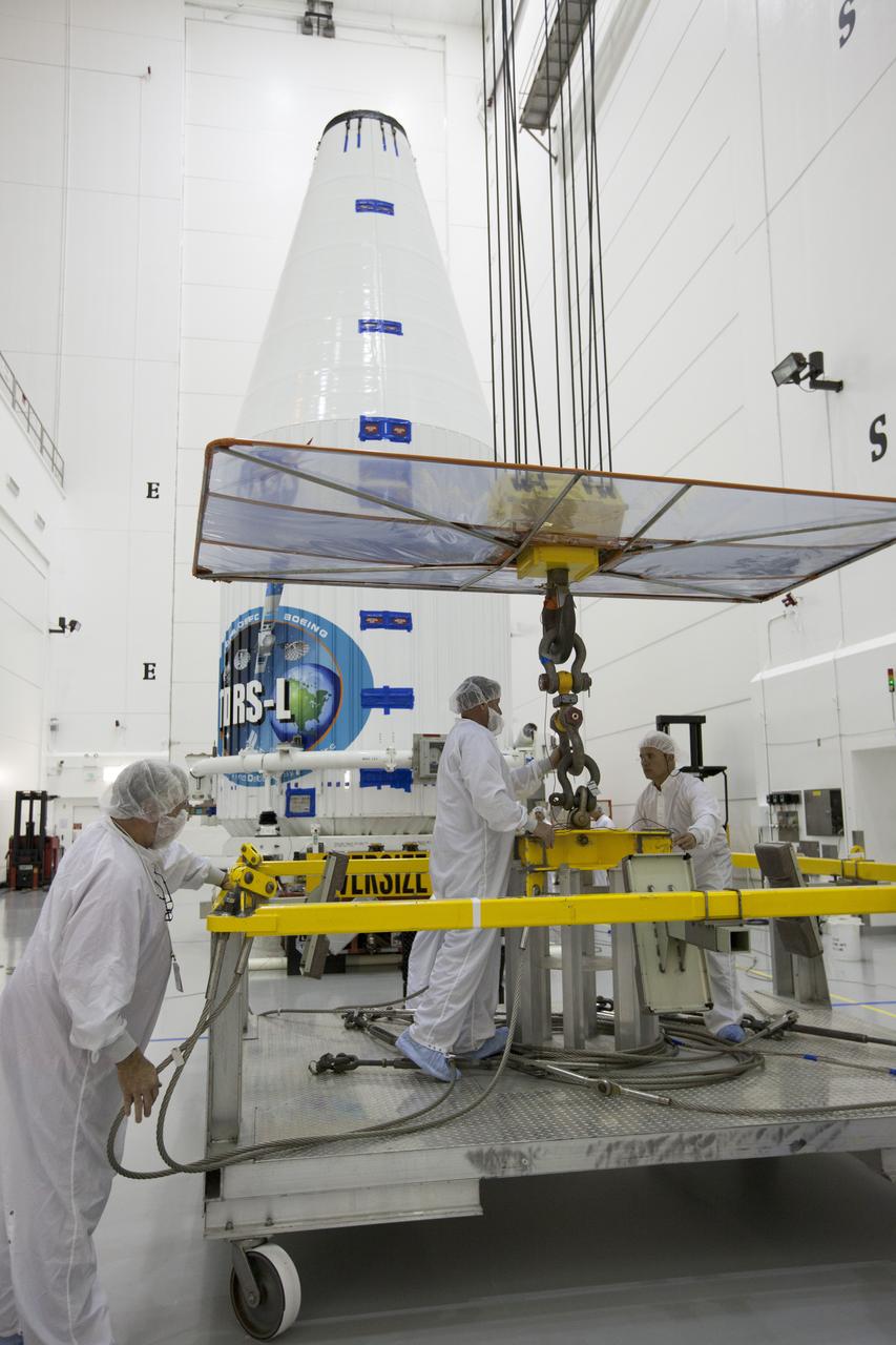 TITUSVILLE, Fla. – Inside the Astrotech payload processing facility in Titusville, a crane is disengaged from ground support equipment used to mount NASA's Tracking and Data Relay Satellite, or TDRS-L, spacecraft on a transporter for its trip to Launch Complex 41 at Cape Canaveral Air Force Station. The TDRS-L satellite will be a part of the second of three next-generation spacecraft designed to ensure vital operational continuity for the NASA Space Network. It is scheduled to launch from Cape Canaveral's Space Launch Complex 41 atop a United Launch Alliance Atlas V rocket on January 23, 2014. The current Tracking and Data Relay Satellite system consists of eight in-orbit satellites distributed to provide near continuous information relay contact with orbiting spacecraft ranging from the International Space Station and Hubble Space Telescope to the array of scientific observatories. For more information, visit: http://www.nasa.gov/mission_pages/tdrs/home/index.html Photo credit: NASA/Kim Shiflett