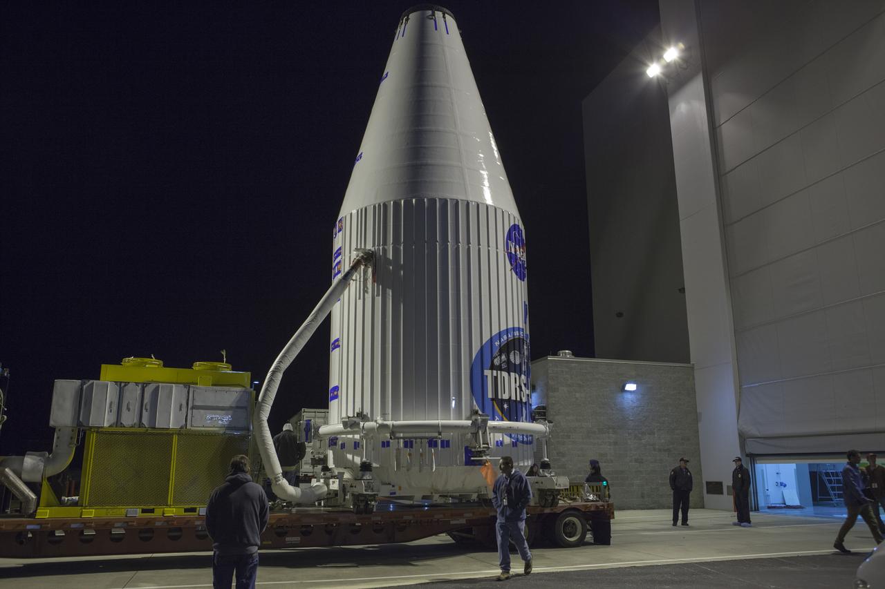 TITUSVILLE, Fla. – Encapsulated in its payload fairing, NASA's Tracking and Data Relay Satellite, or TDRS-L, spacecraft begins it trip from the Astrotech payload processing facility in Titusville to Launch Complex 41 at Cape Canaveral Air Force Station. The TDRS-L satellite will be a part of the second of three next-generation spacecraft designed to ensure vital operational continuity for the NASA Space Network. It is scheduled to launch from Cape Canaveral's Space Launch Complex 41 atop a United Launch Alliance Atlas V rocket on January 23, 2014. The current Tracking and Data Relay Satellite system consists of eight in-orbit satellites distributed to provide near continuous information relay contact with orbiting spacecraft ranging from the International Space Station and Hubble Space Telescope to the array of scientific observatories. For more information, visit: http://www.nasa.gov/mission_pages/tdrs/home/index.html Photo credit: NASA/Dimitri Gerondidakis