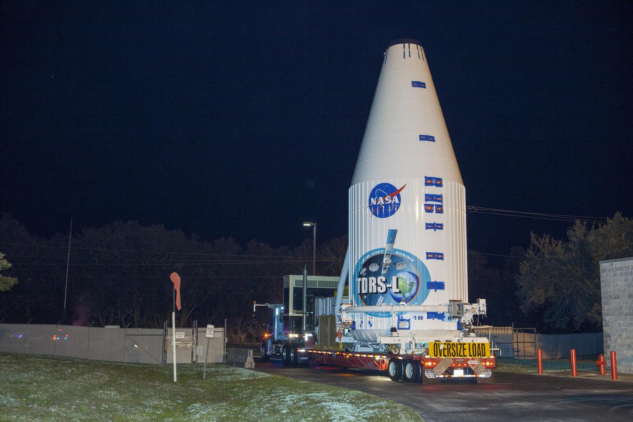 TITUSVILLE, Fla. – Encapsulated in its payload fairing, NASA's Tracking and Data Relay Satellite, or TDRS-L, spacecraft begins it trip from the Astrotech payload processing facility in Titusville to Launch Complex 41 at Cape Canaveral Air Force Station. The TDRS-L satellite will be a part of the second of three next-generation spacecraft designed to ensure vital operational continuity for the NASA Space Network. It is scheduled to launch from Cape Canaveral's Space Launch Complex 41 atop a United Launch Alliance Atlas V rocket on January 23, 2014. The current Tracking and Data Relay Satellite system consists of eight in-orbit satellites distributed to provide near continuous information relay contact with orbiting spacecraft ranging from the International Space Station and Hubble Space Telescope to the array of scientific observatories. For more information, visit: http://www.nasa.gov/mission_pages/tdrs/home/index.html Photo credit: NASA/Dimitri Gerondidakis